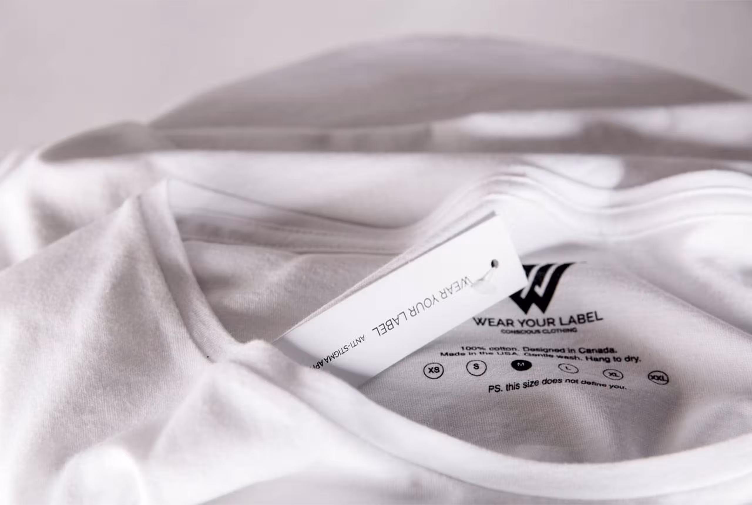 A custom hang tag and custom printed tag for Wear Your Label