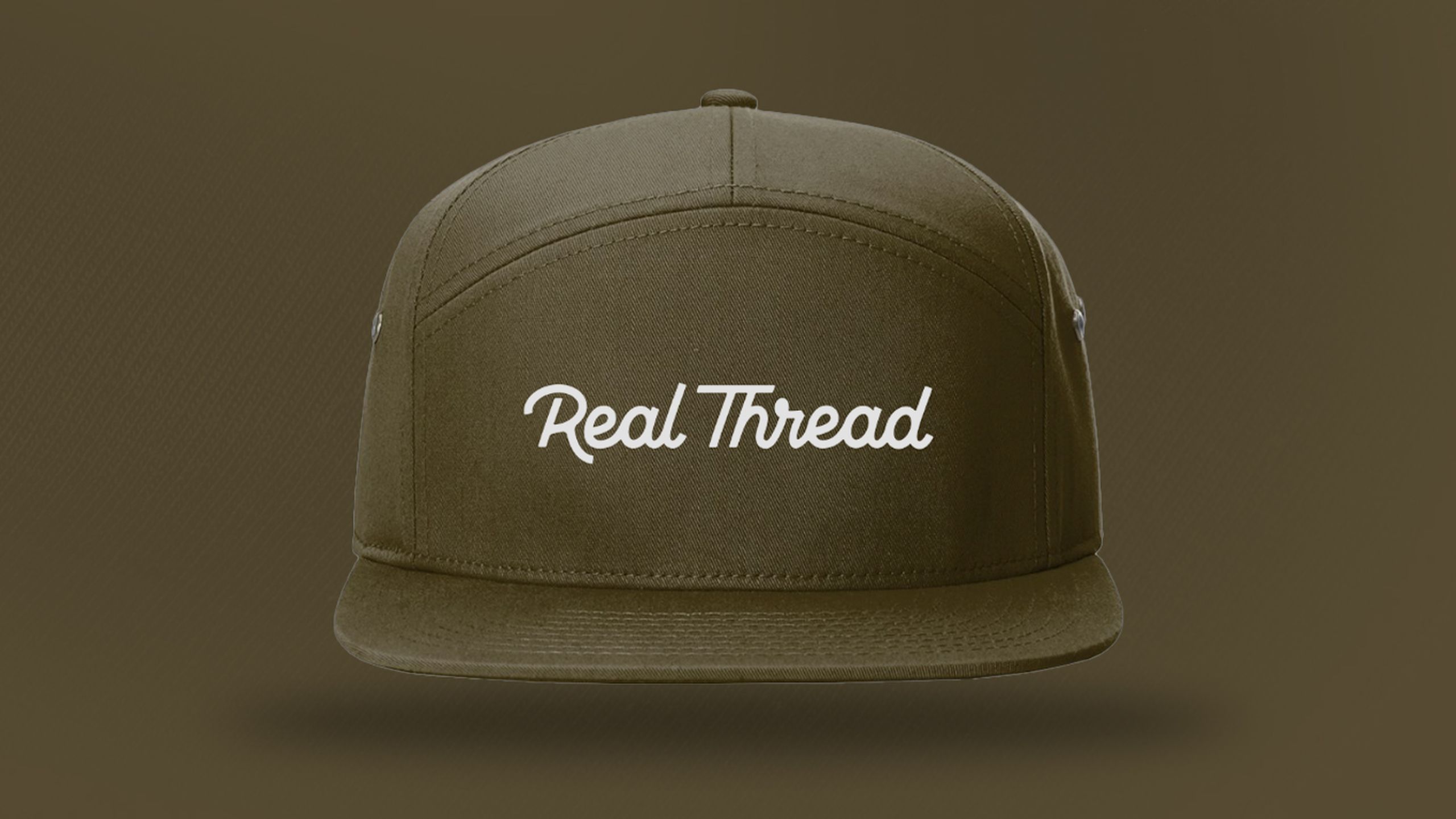 A olive green hat with real thread on it