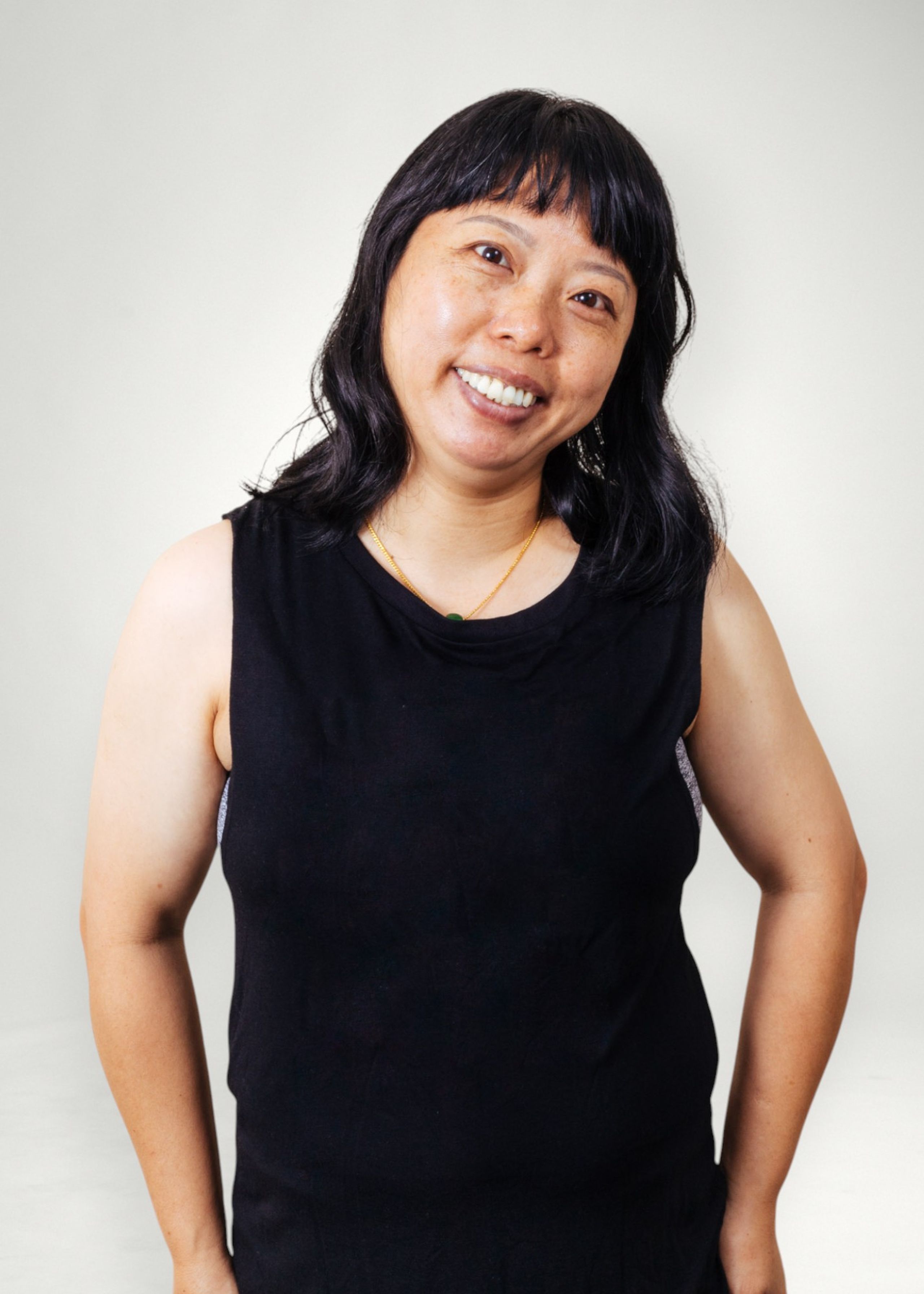 Yuchan poses in front of white background