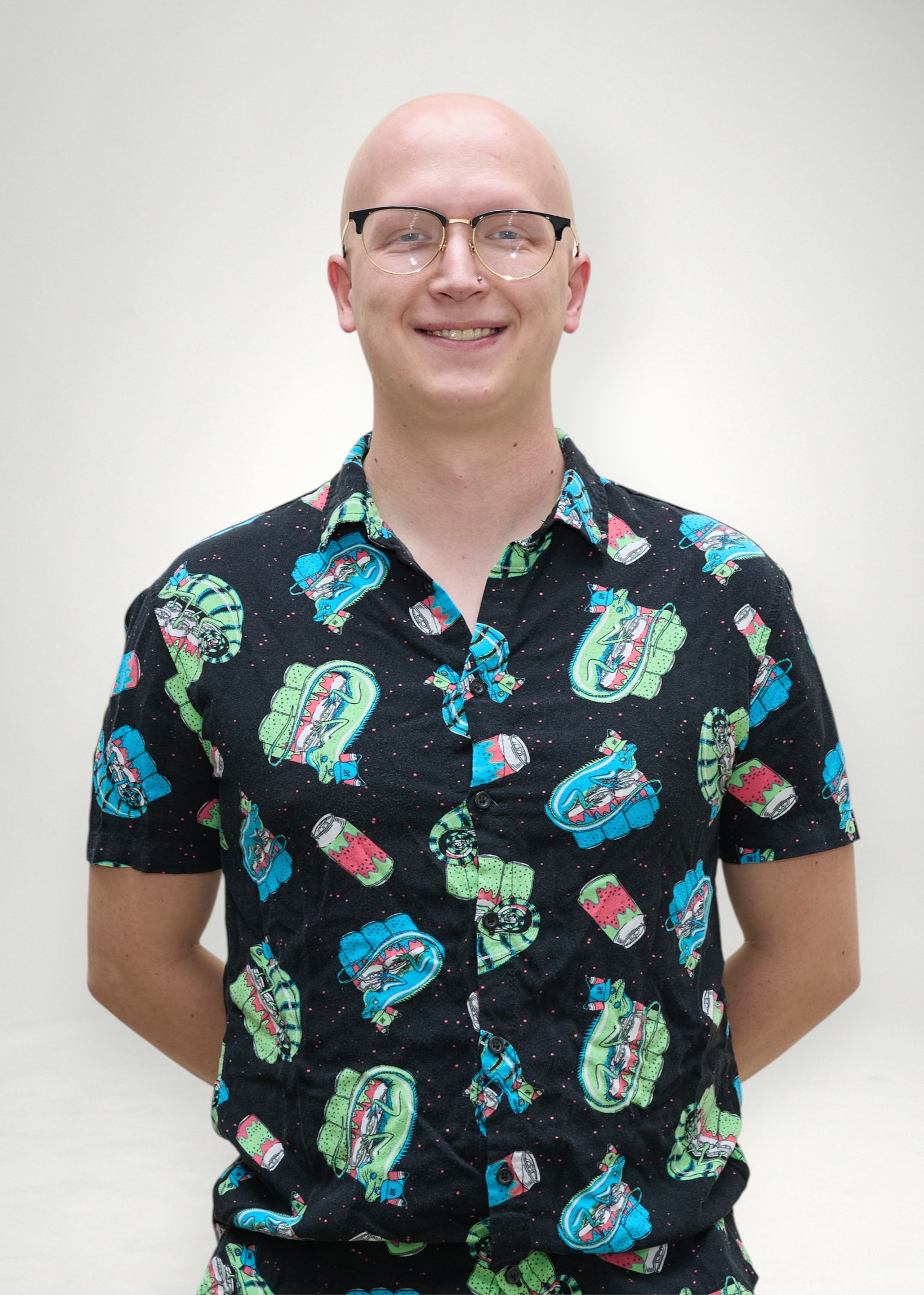 Caleb poses in front of white background