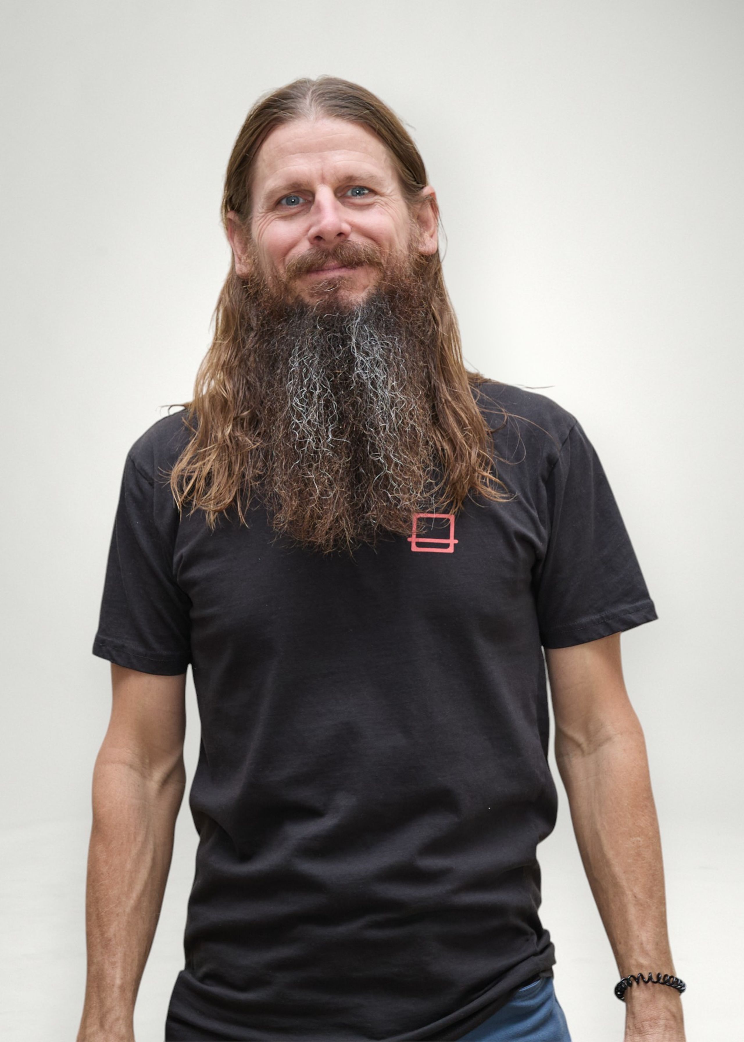 Jeremy poses in front of white background