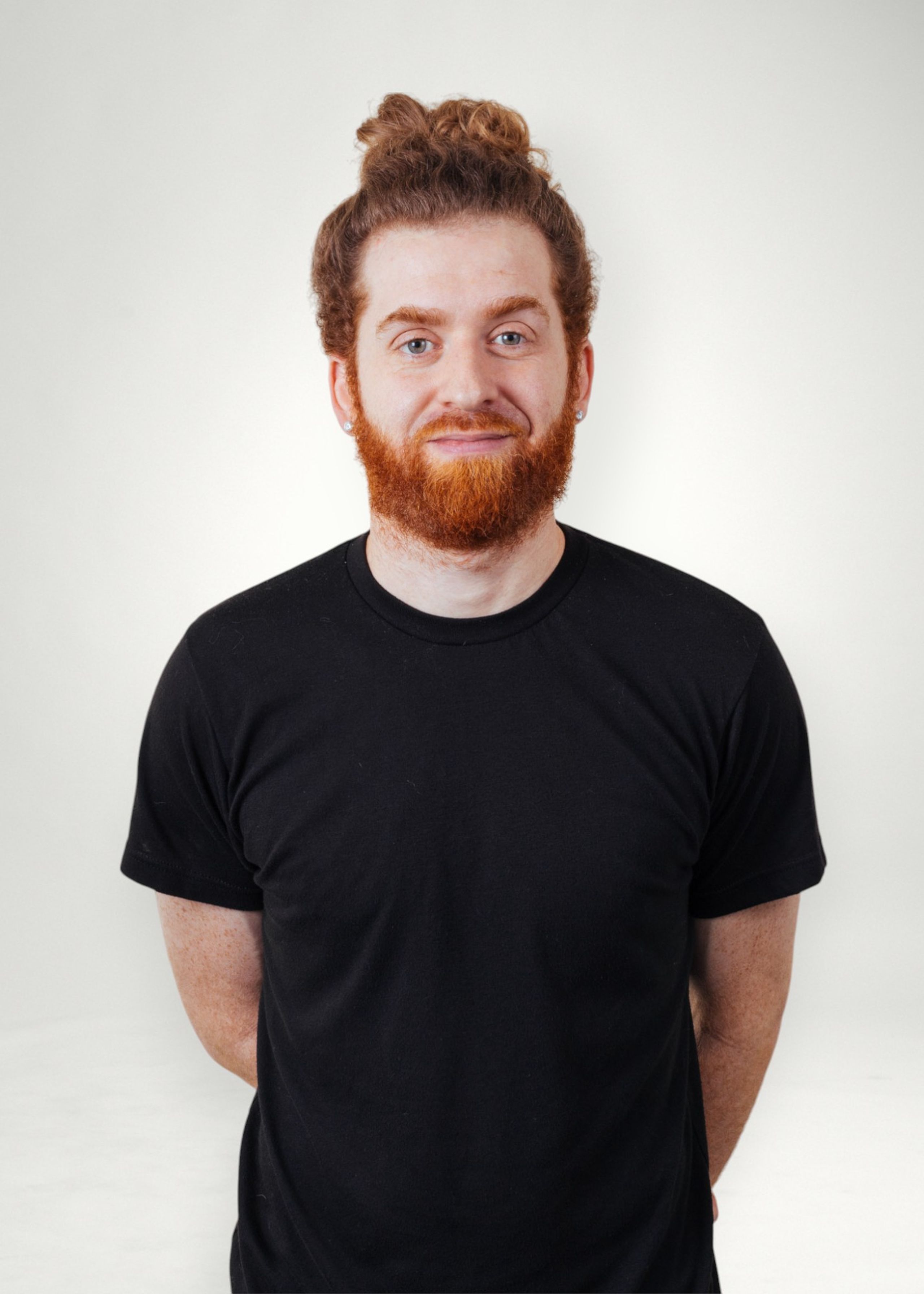 Jeremiah poses in front of white background