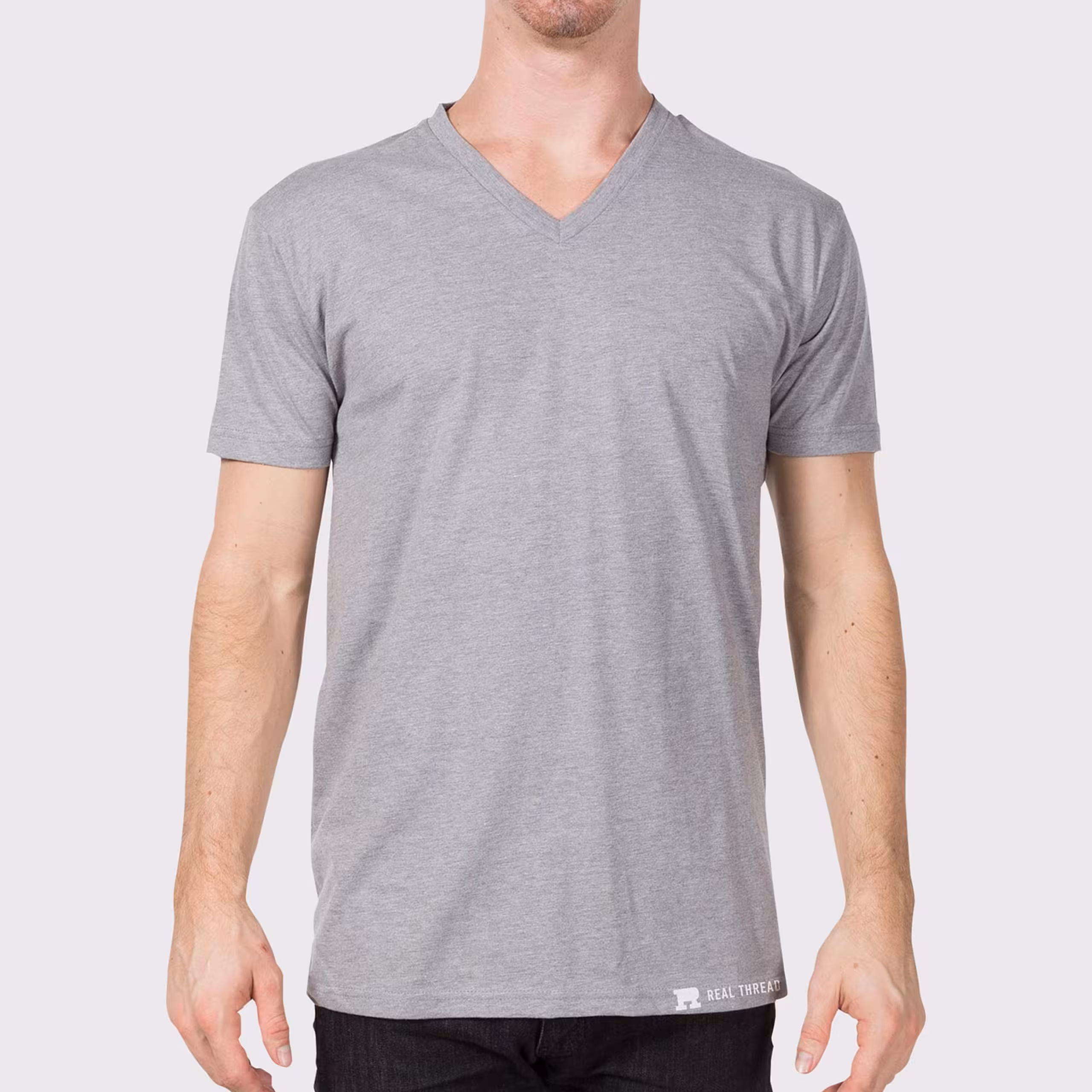 man wearing a light grey v-neck t-shirt