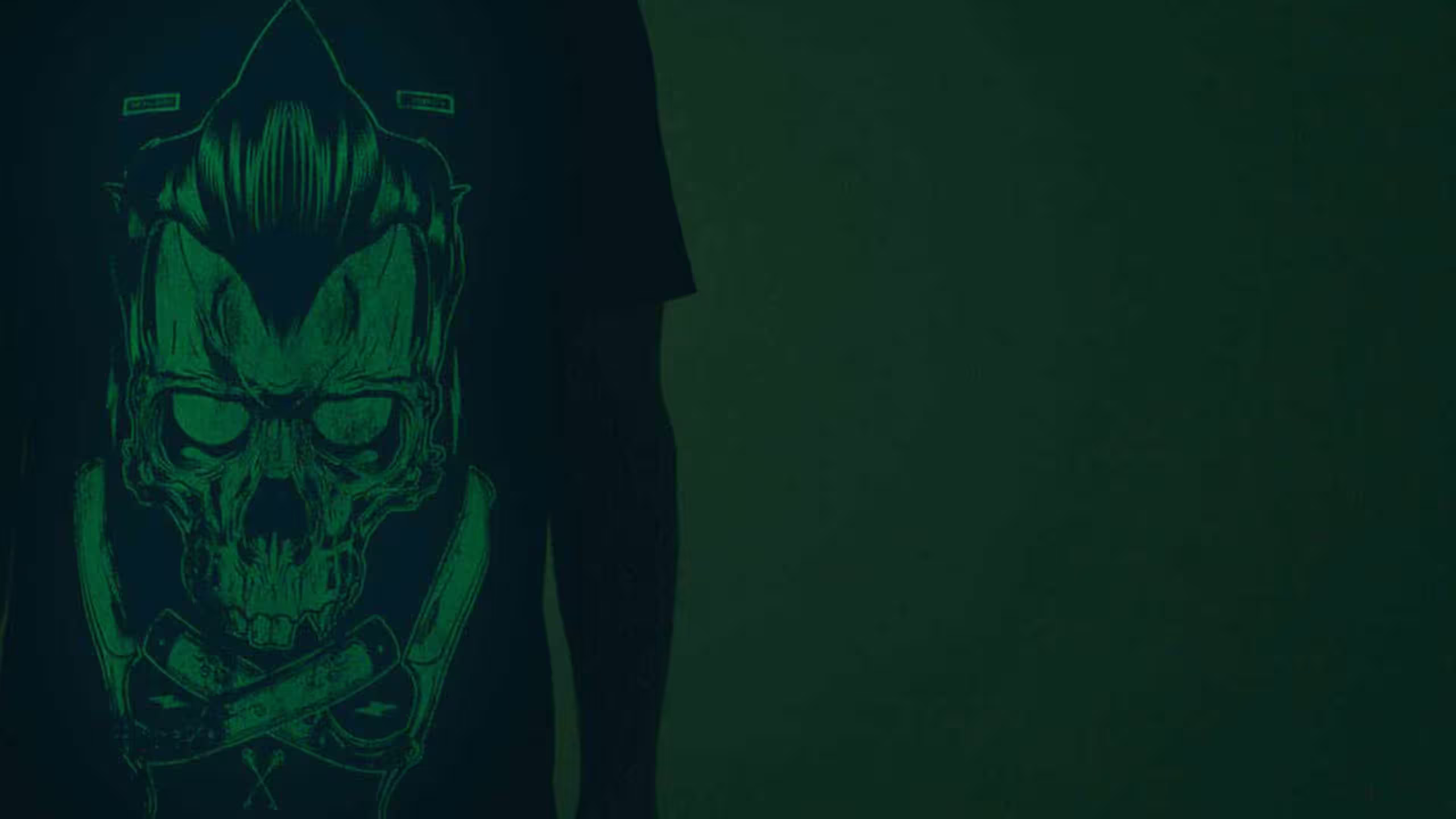 close up of a black shirt with a green glow-in-the-dark print