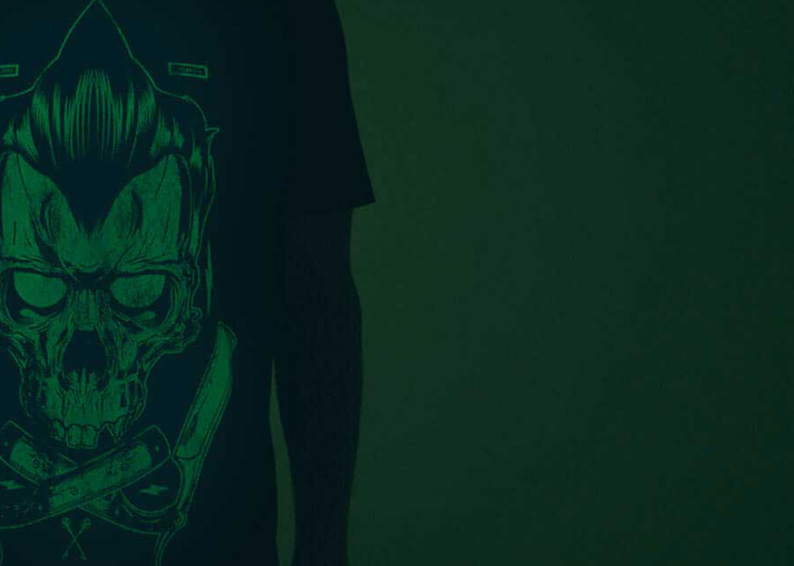 close up of a black shirt with a green glow-in-the-dark print