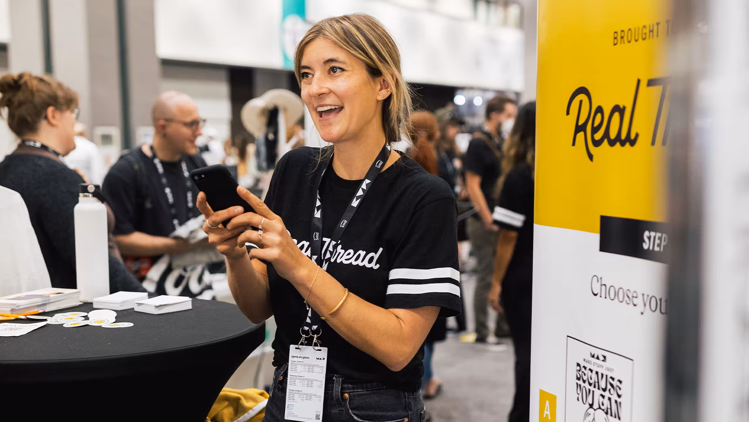 women smiling at the real thread booth
