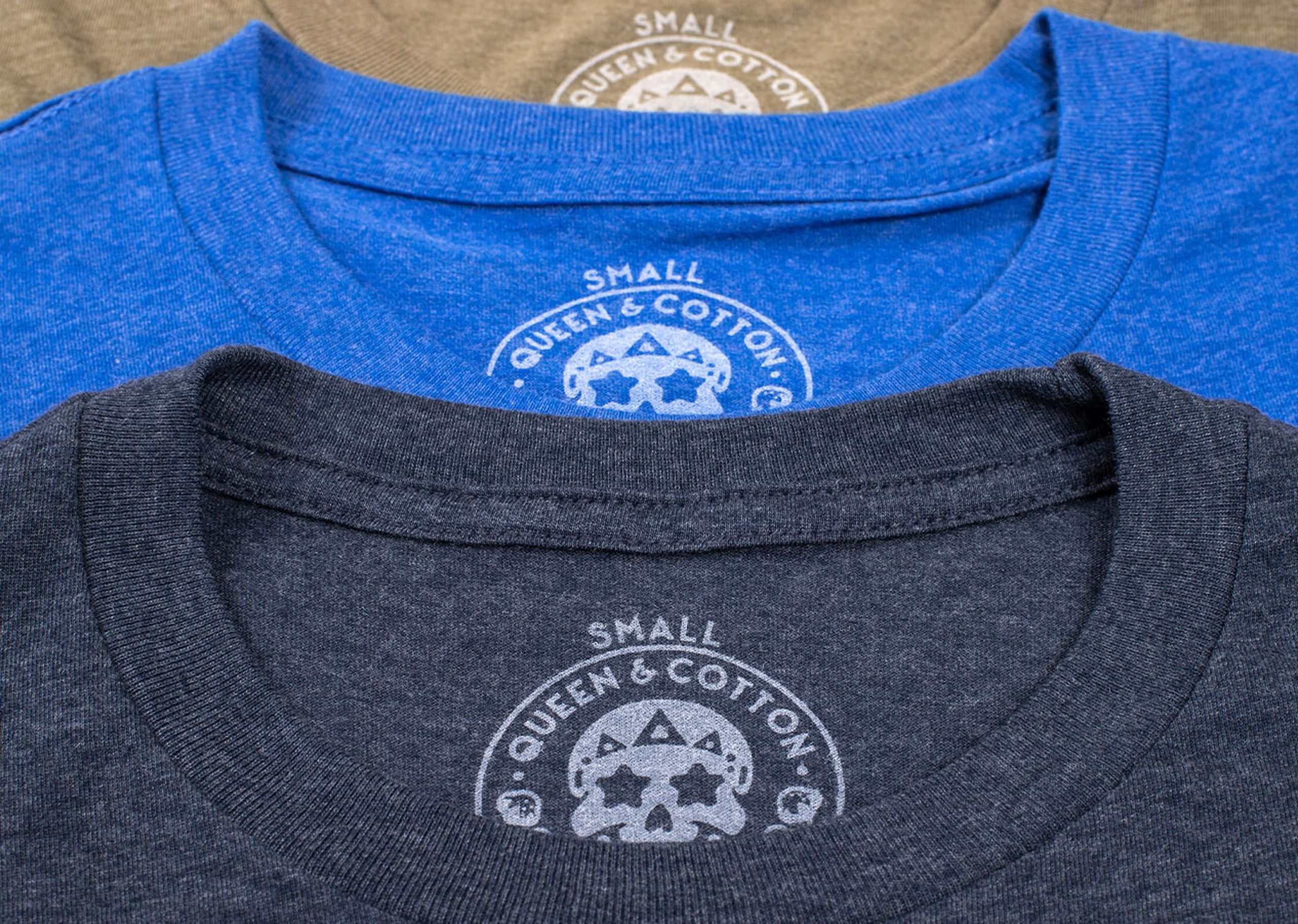 a close-up of three t-shirts printed tag