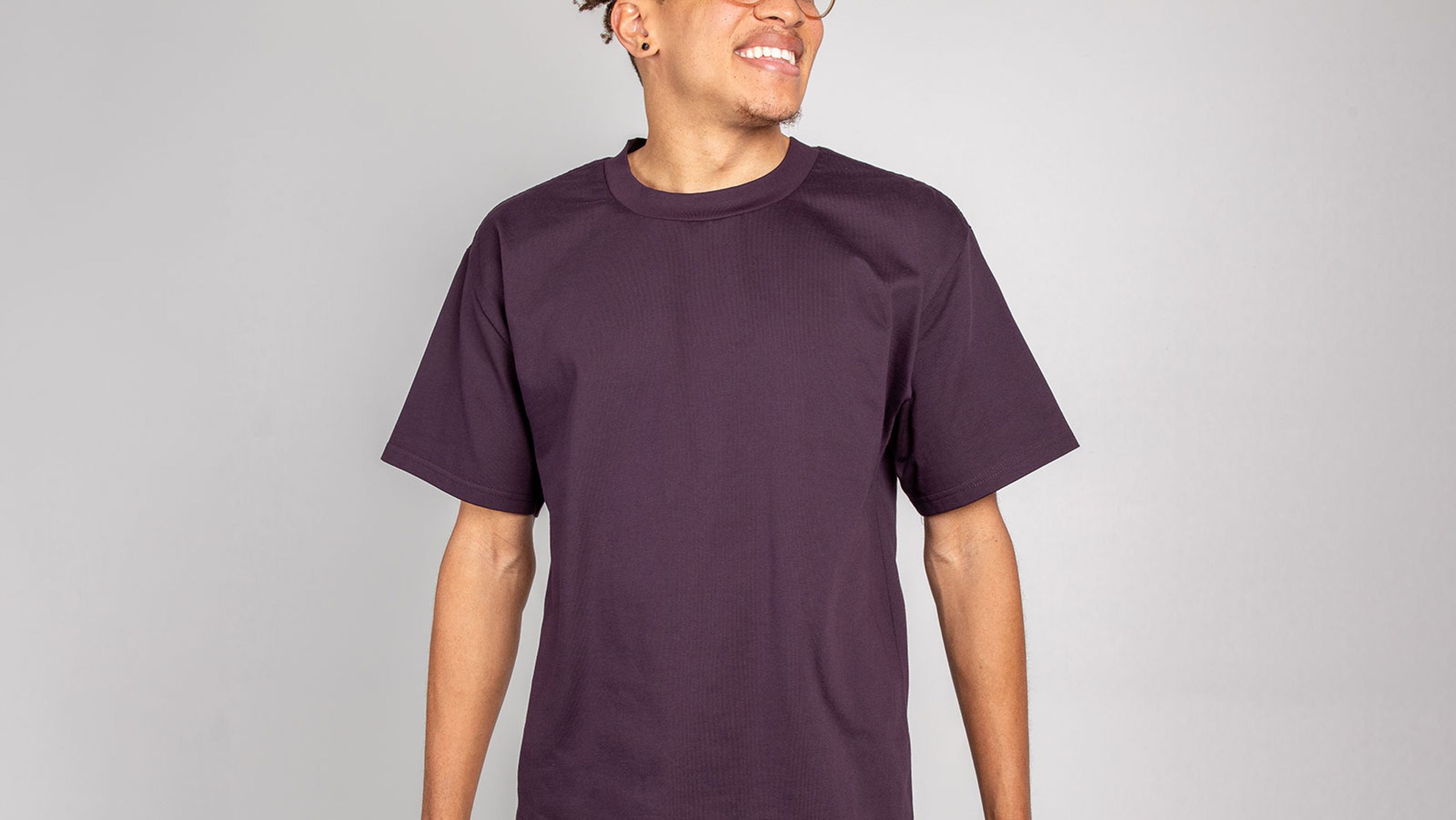 man wearing a plum color t-shirt