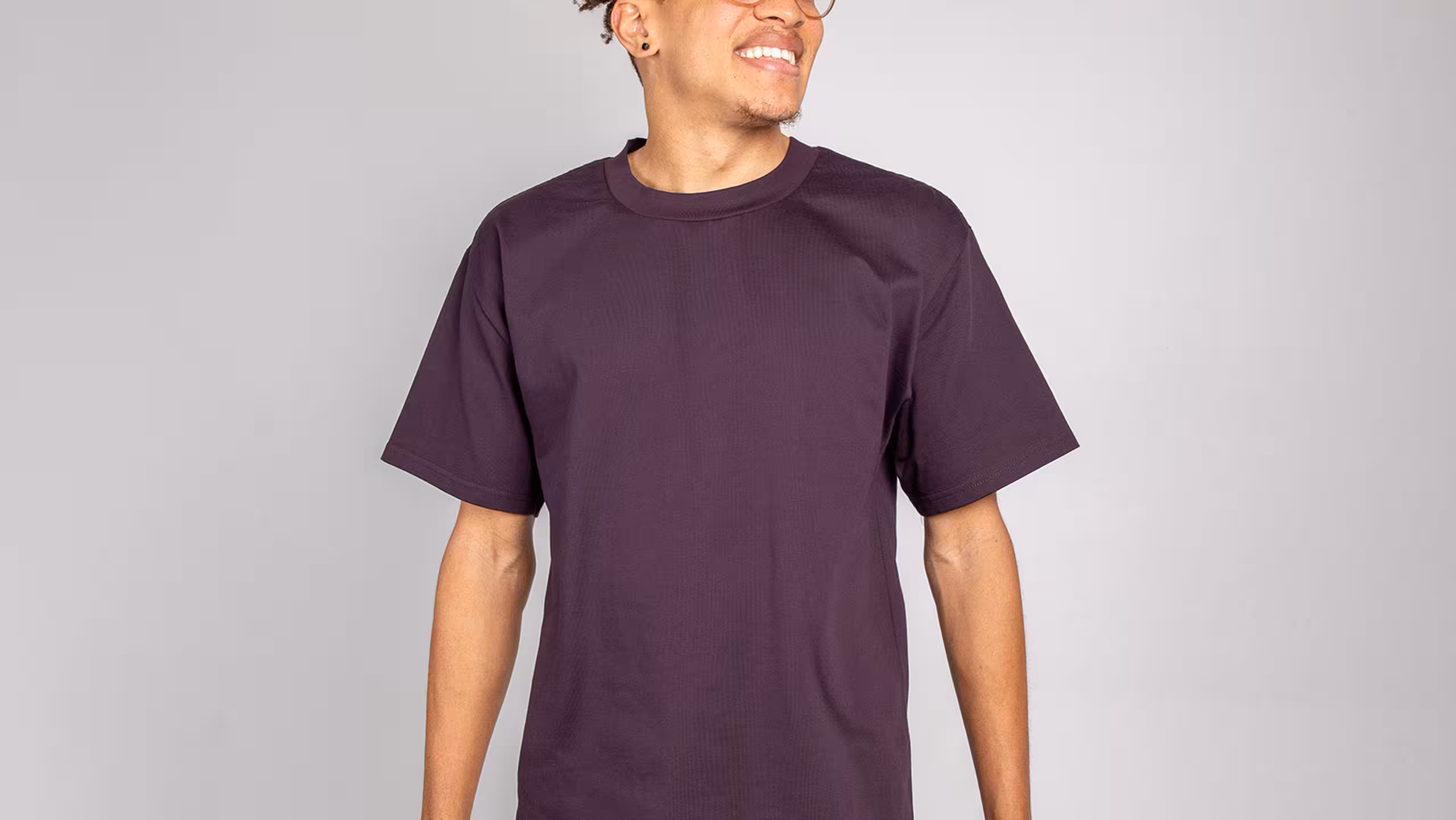 man wearing a plum color t-shirt