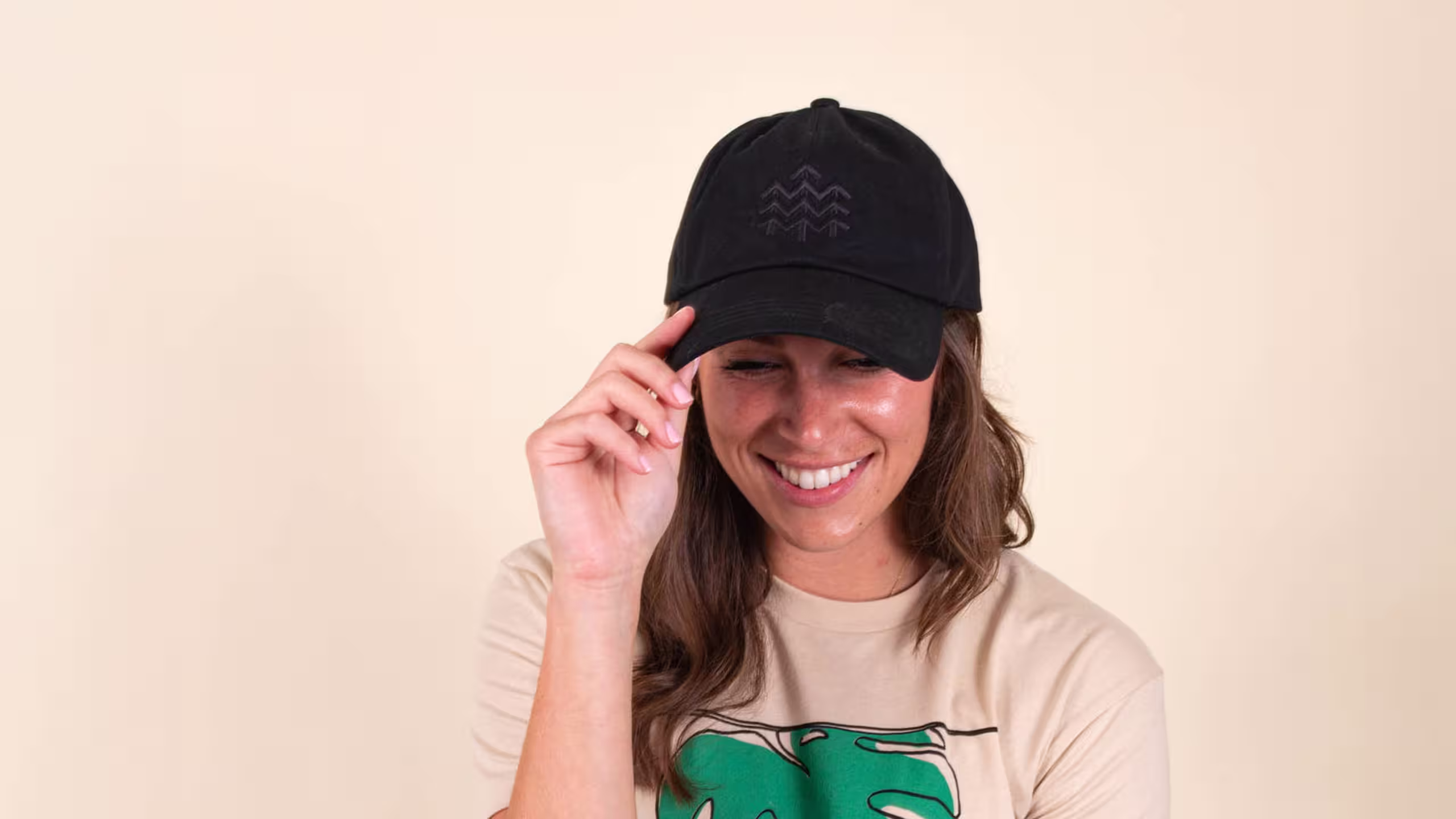 woman wearing a black dad hat