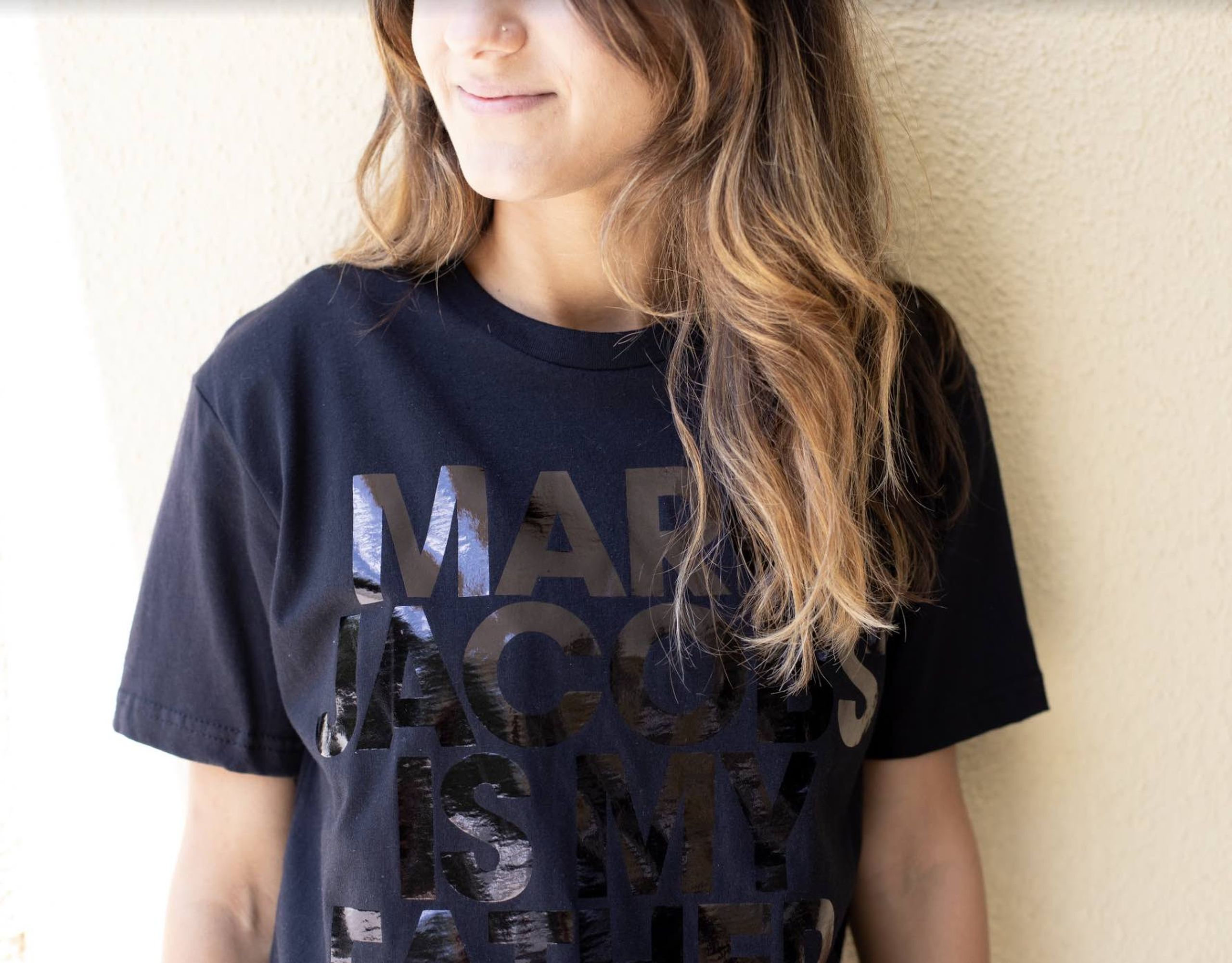 women wearing a black t-shirt with black foil print