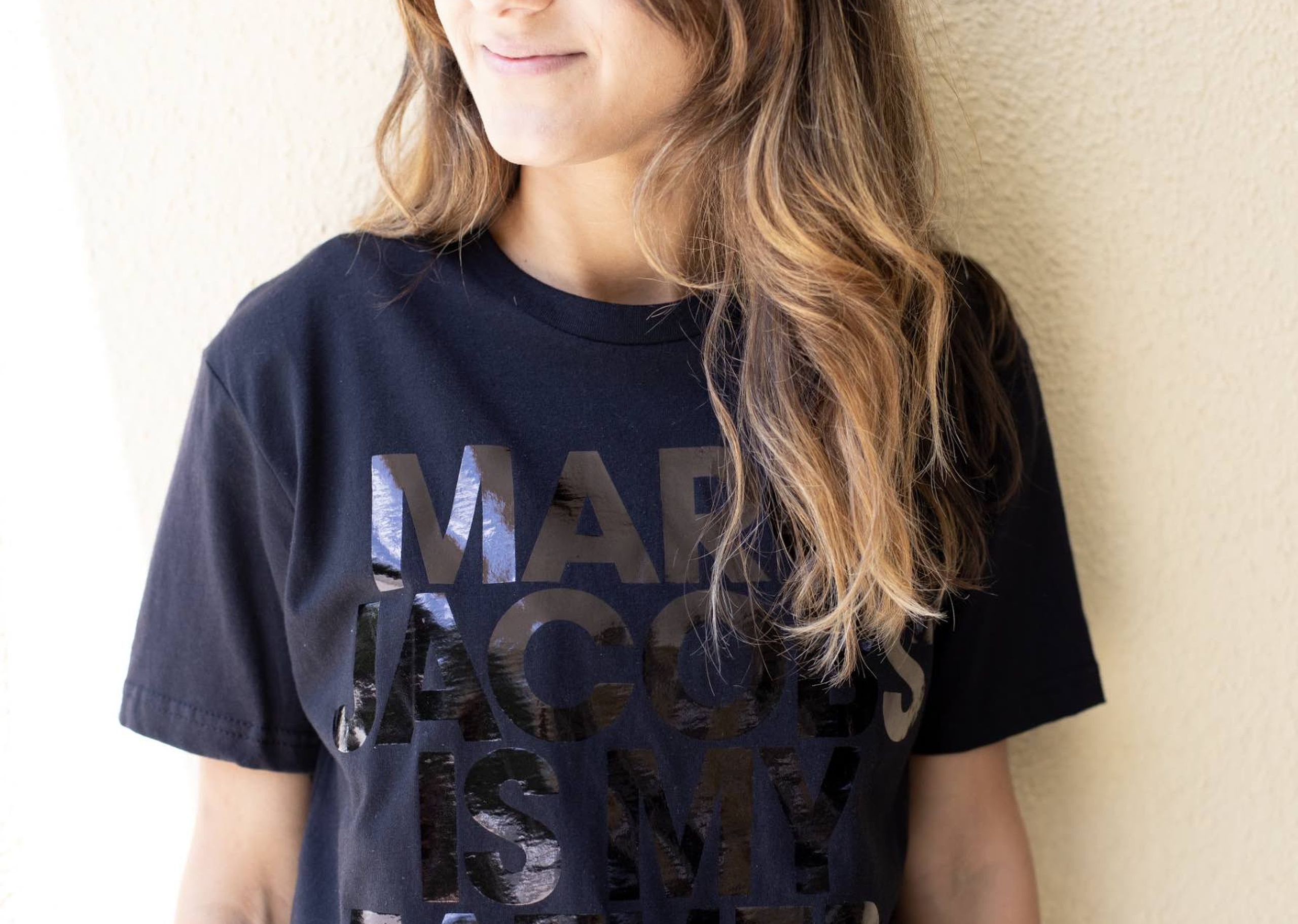 women wearing a black t-shirt with black foil print