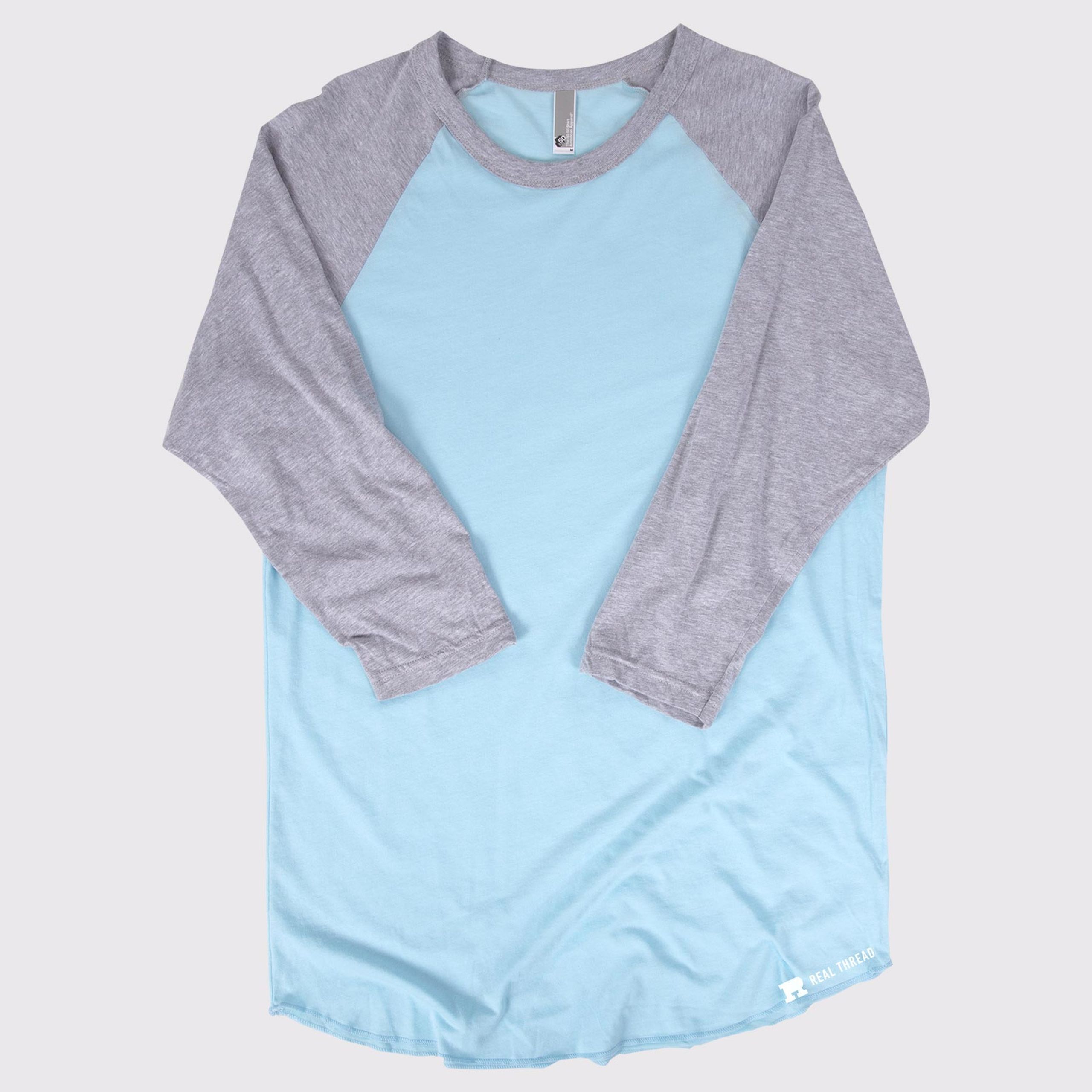 three quarter length sleeve shirt laying flat