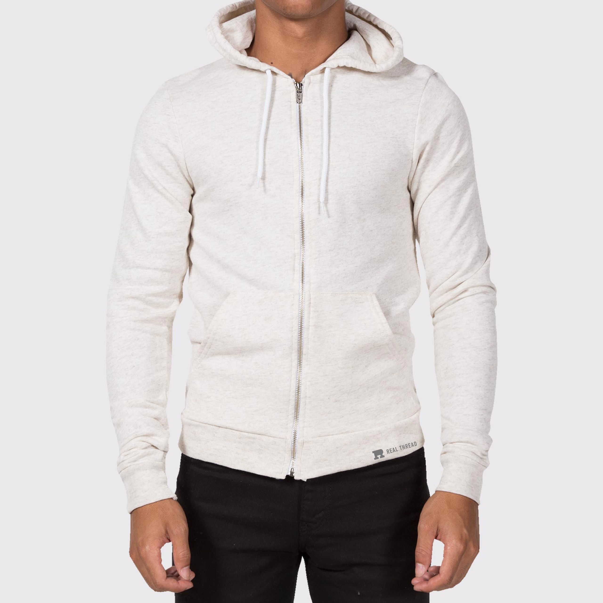 man wearing a light tan zip-up hoodie