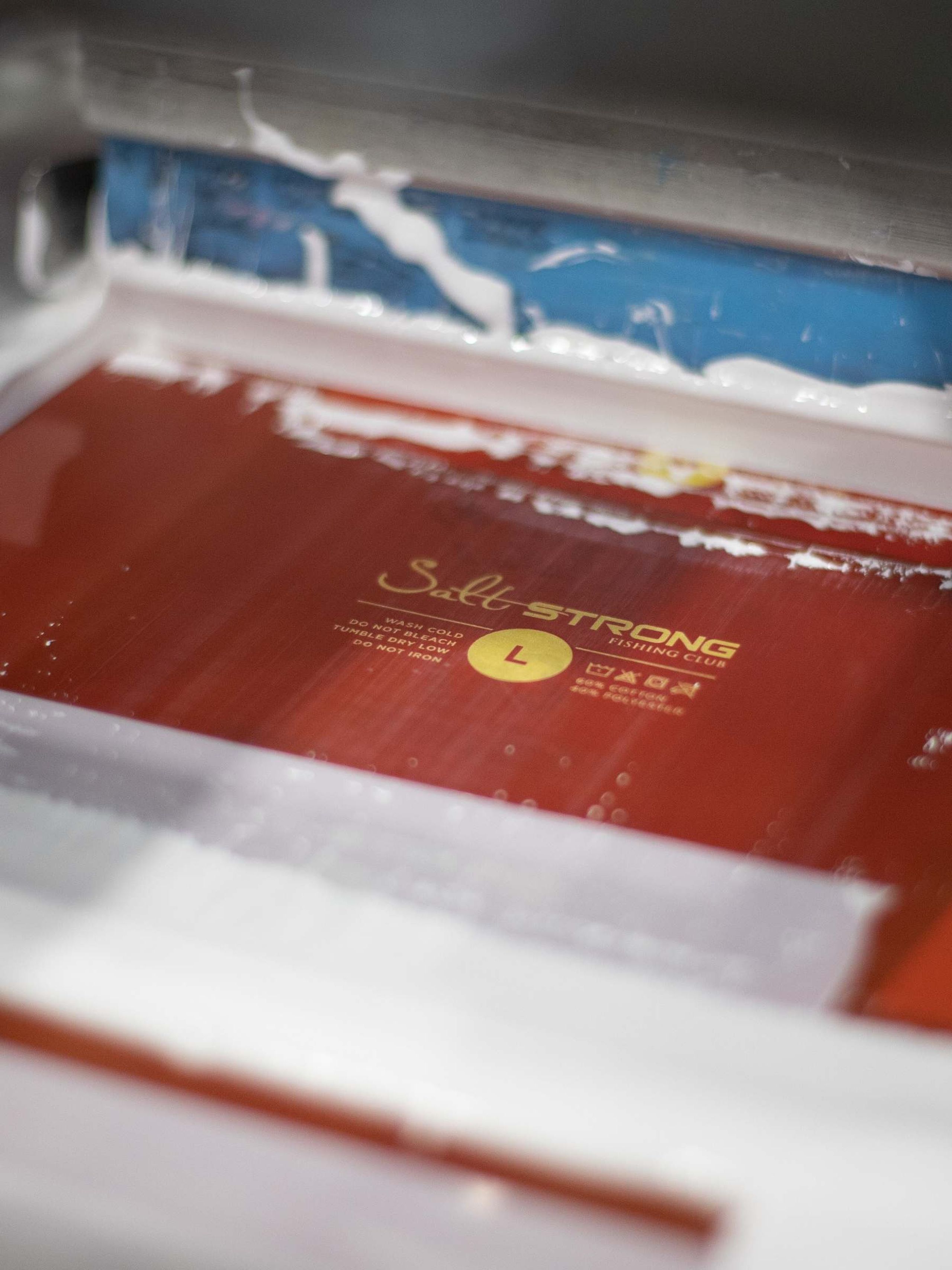 A screen burned with custom printed tag design 