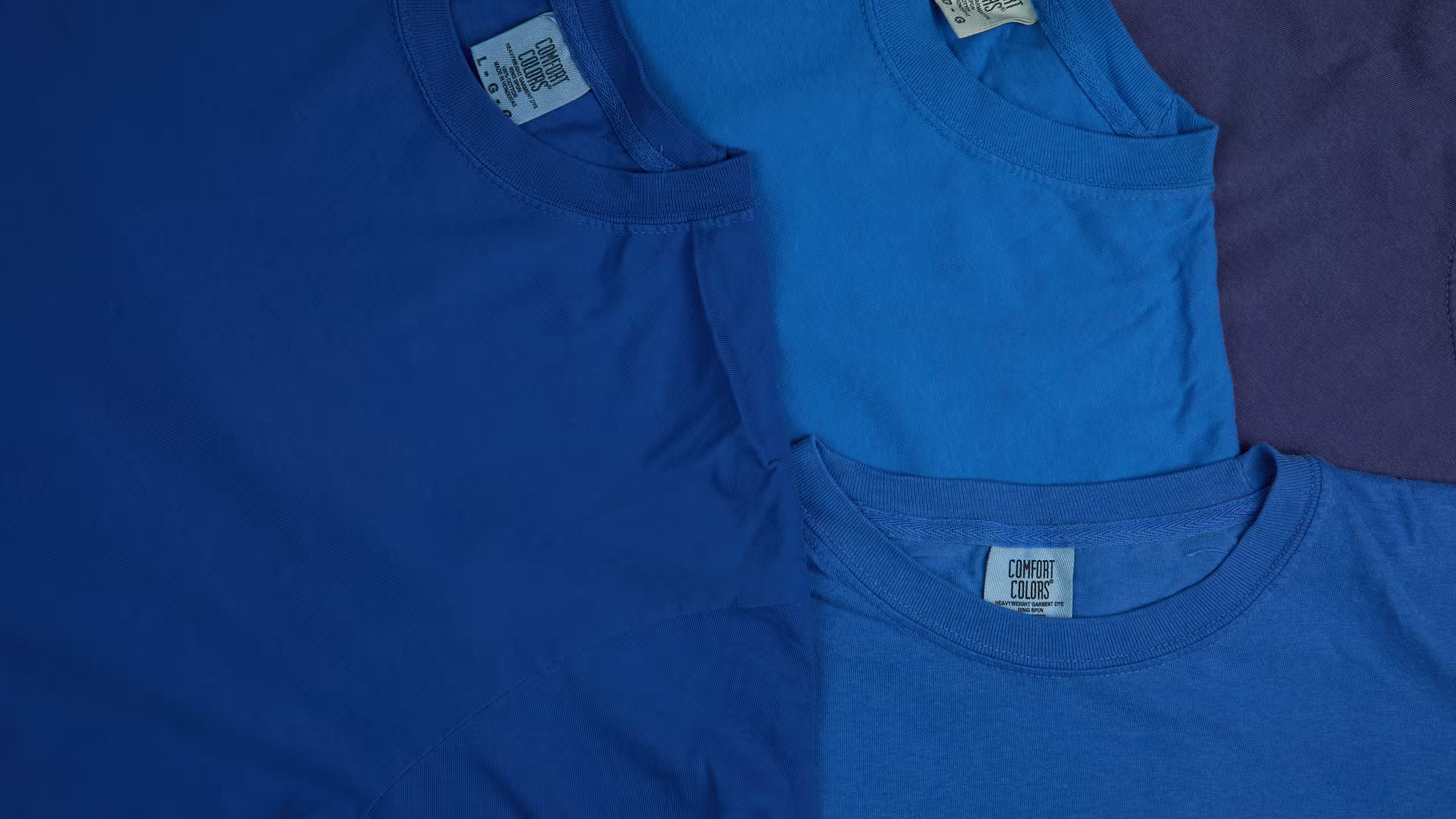 close-up of blue comfort color t-shirts