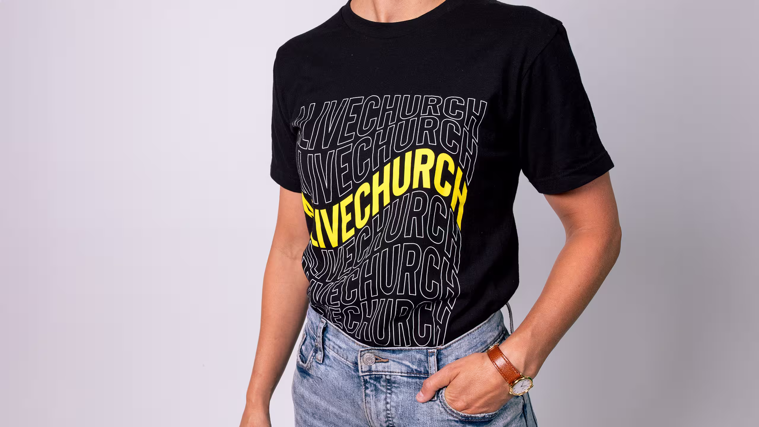 women wearing a black t-shirt with yellow and white lettering