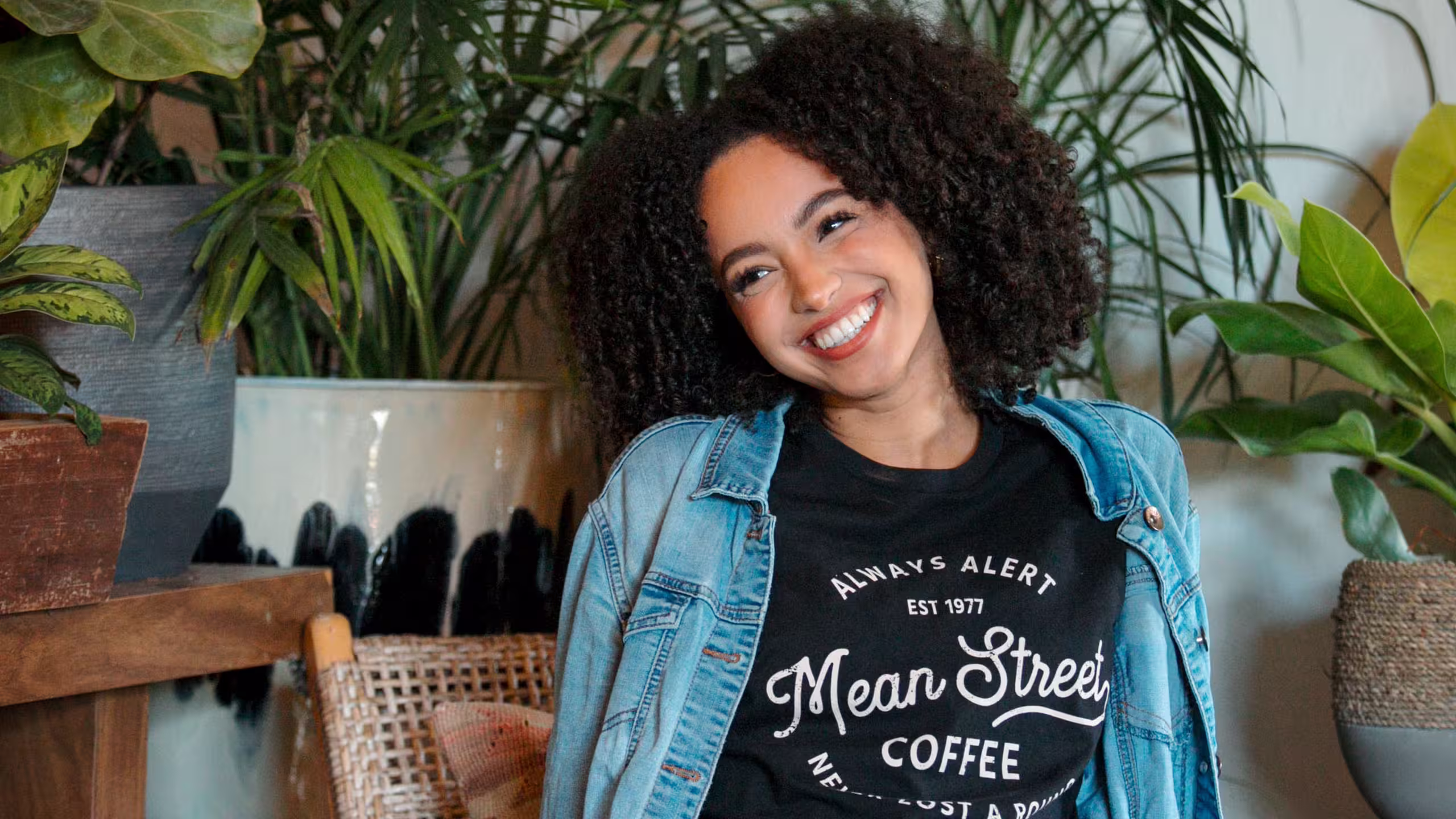 women wearing a black t-shirt with light blue denim jacket