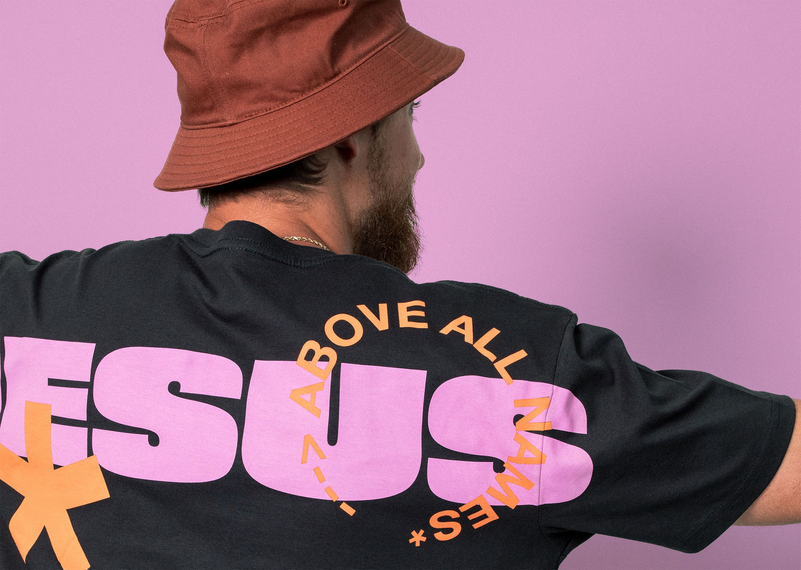 close up of a pink print going over the seams of a t-shirt