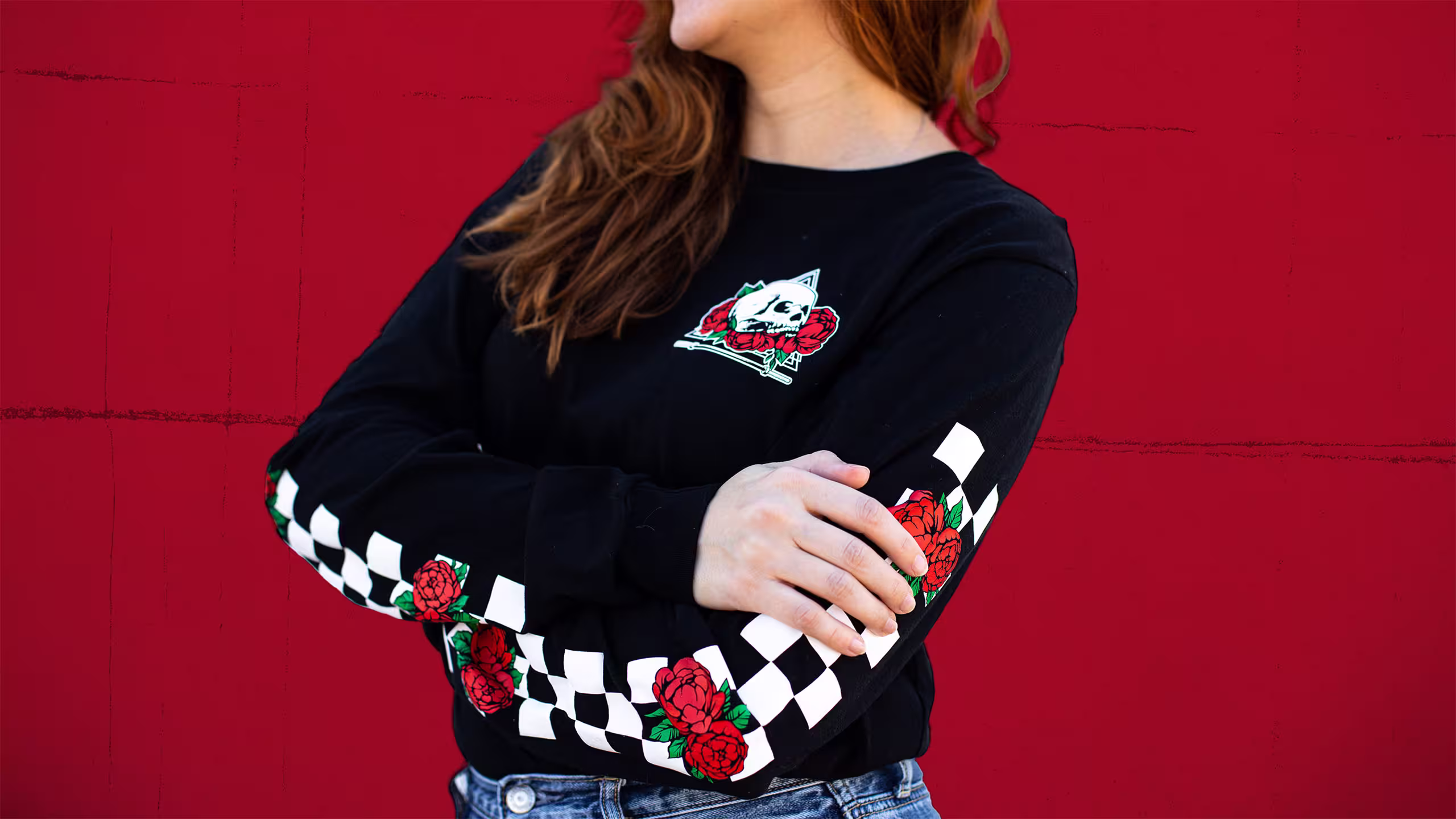 women with a black long-sleeve t-shirt with a sleeve checker print with roses