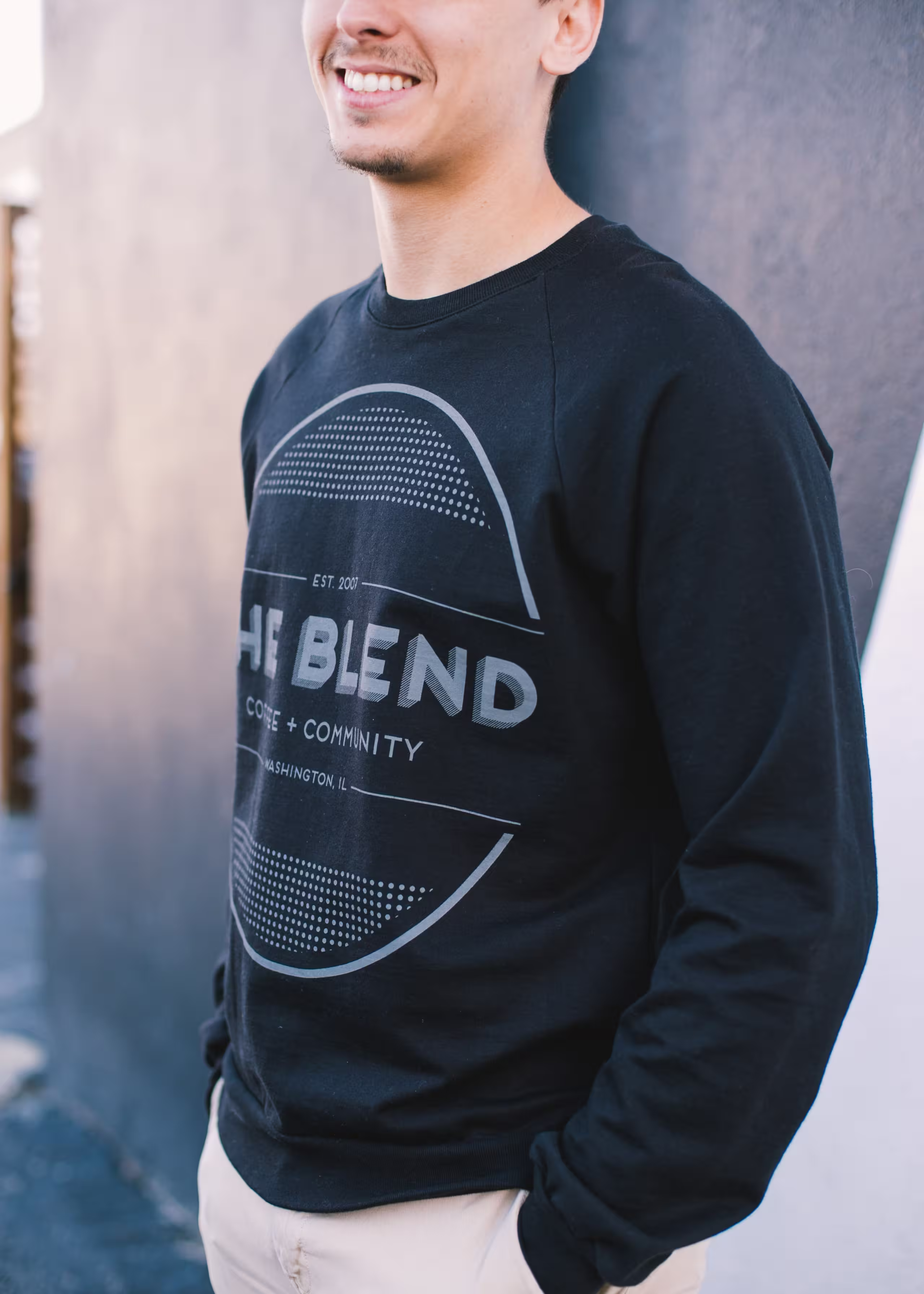 man wearing a black crewneck sweatshirt