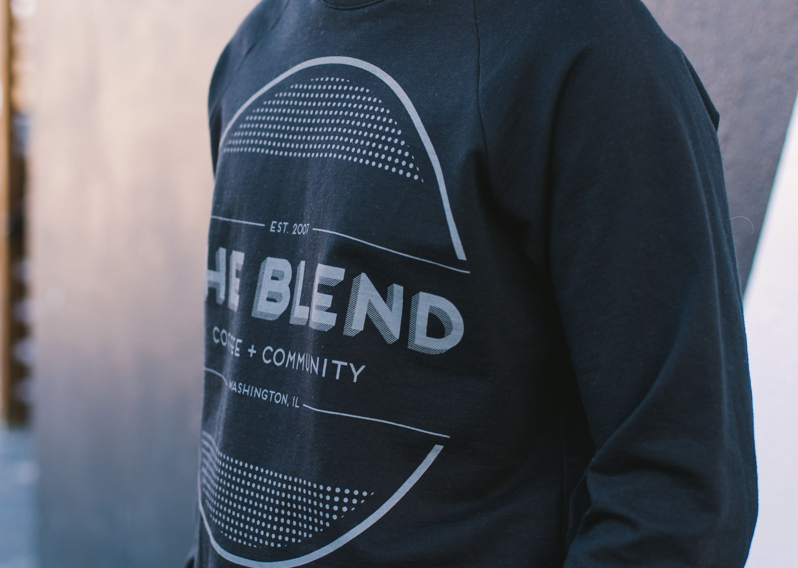 man wearing a black crewneck sweatshirt