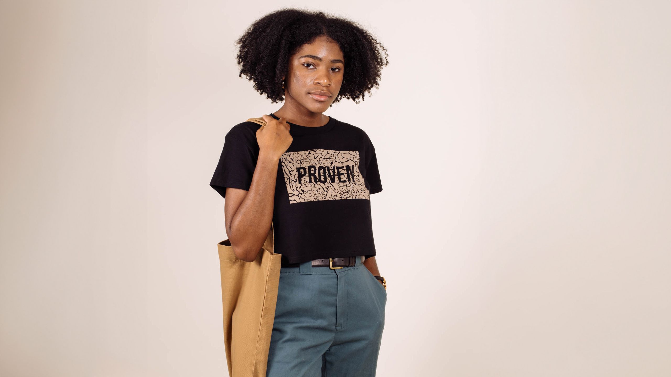women wearing a black shirt holding a yellow bag