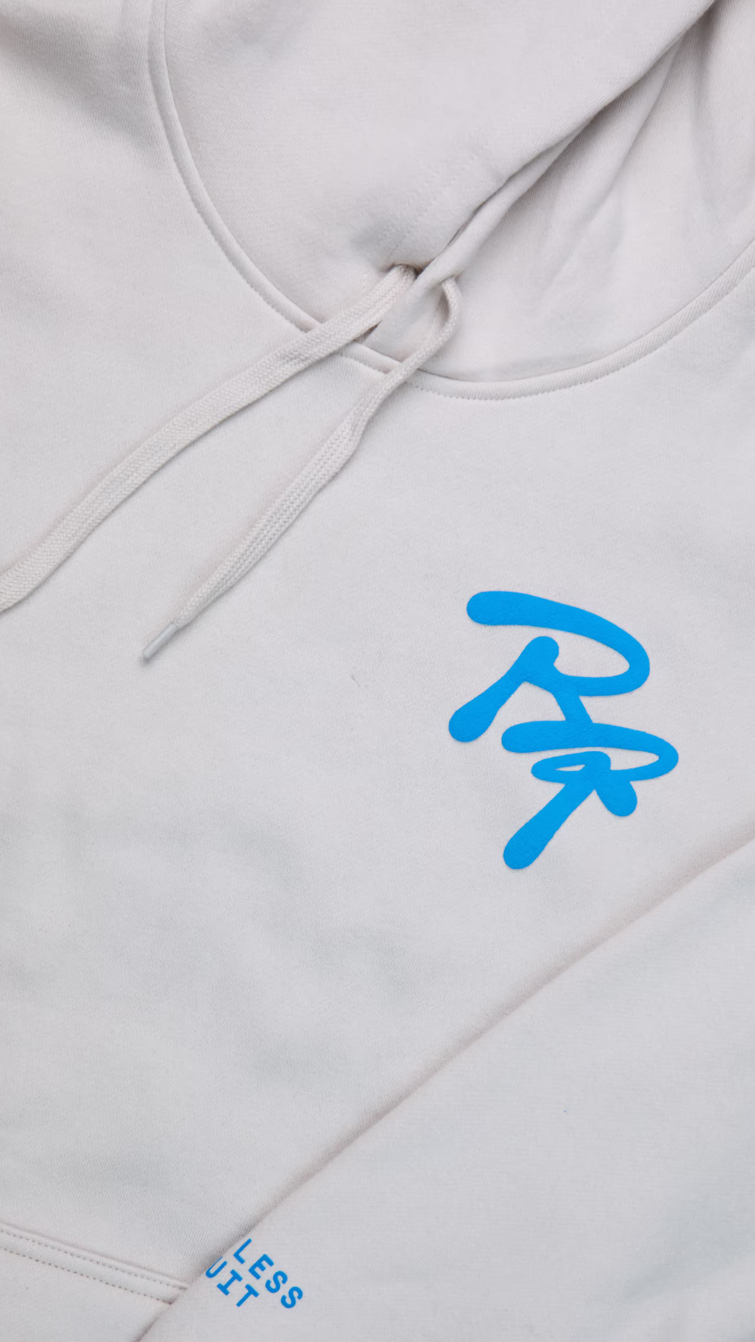 close-up of light blue puff print on a white hoodie