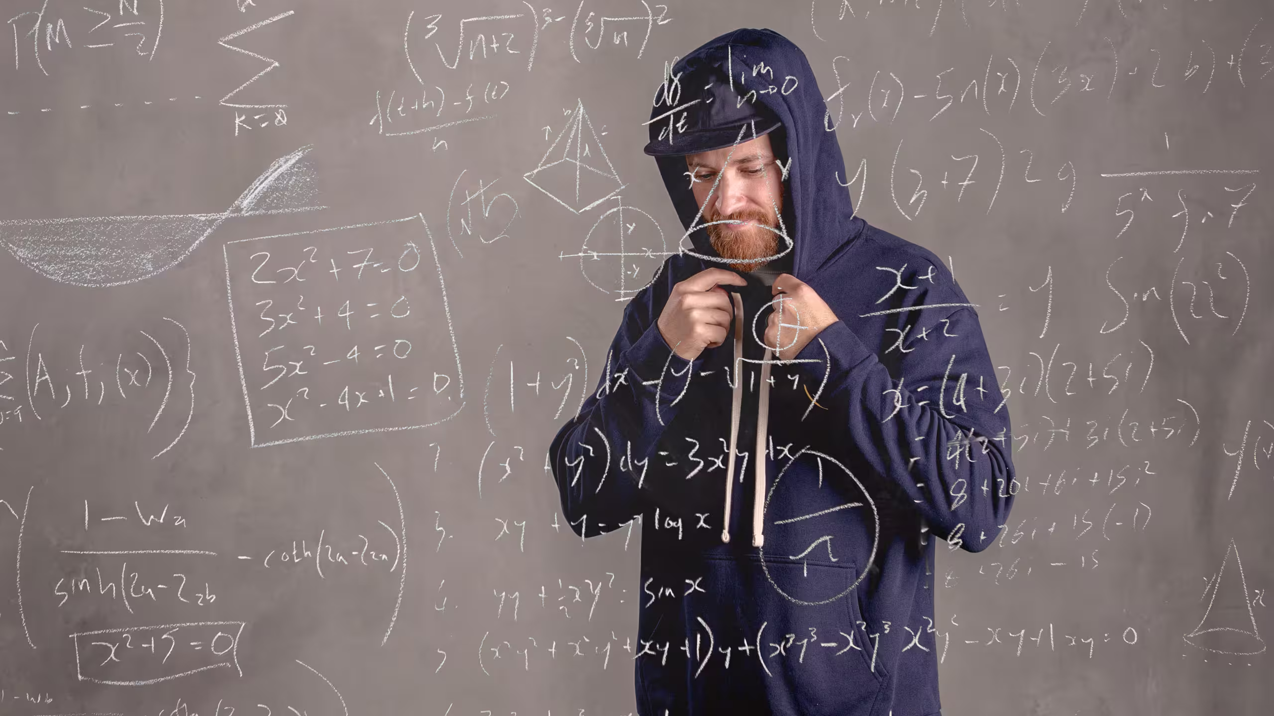 Man wearing a navy hoodie with math equations overlaying the image
