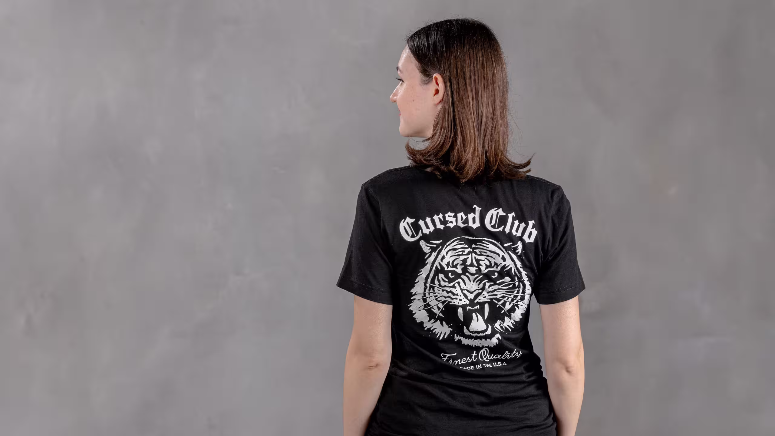 the back of a women wearing a black t-shirt