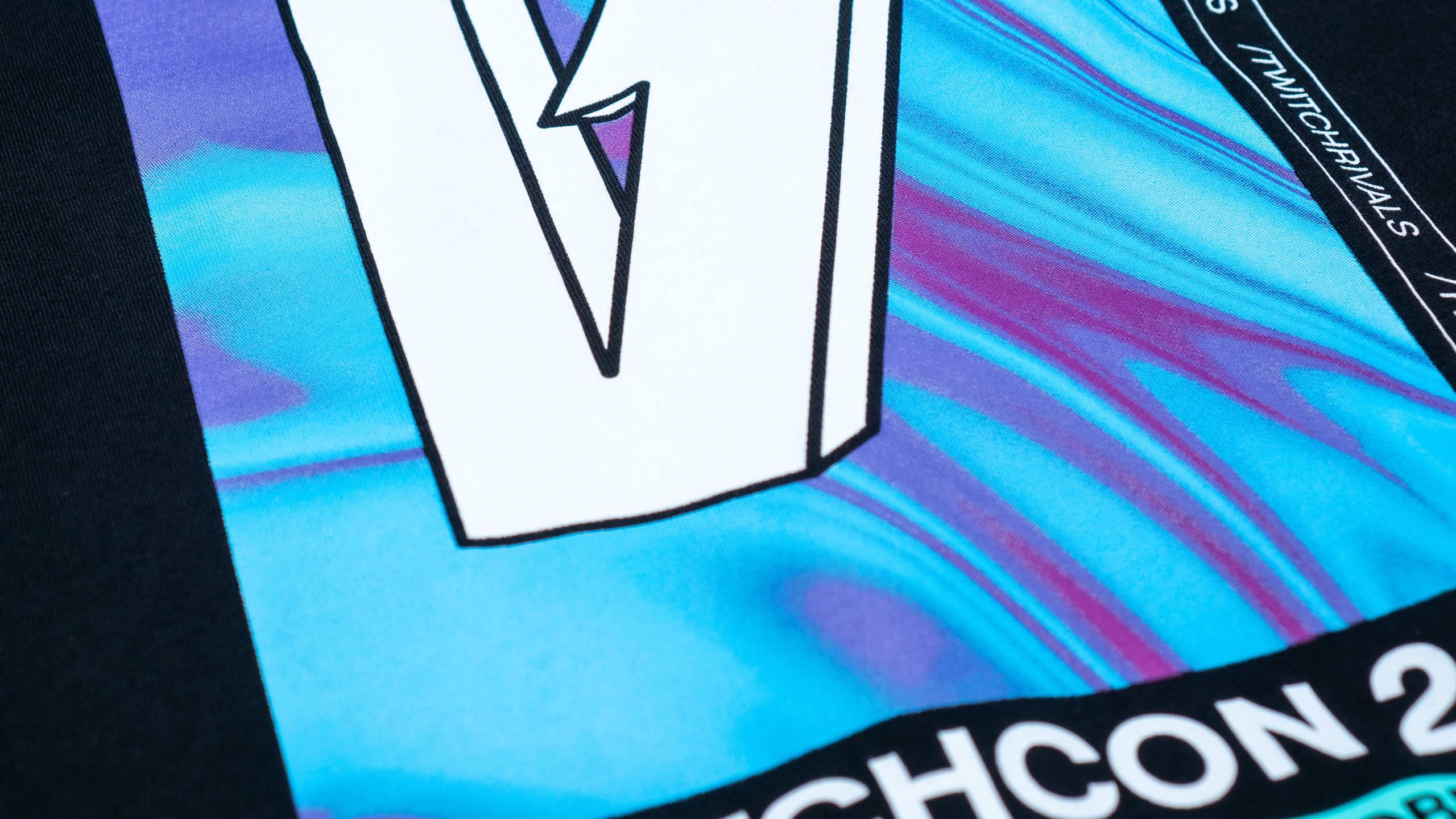 close-up on bold ink style on a black t-shirt