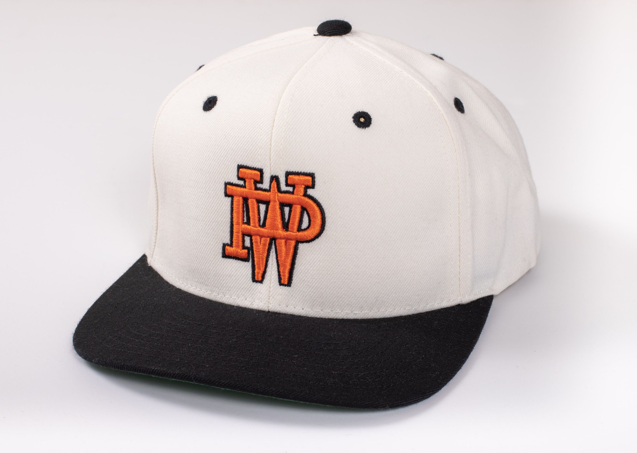 A white hat with a black brim, embroidered with an orange W and P
