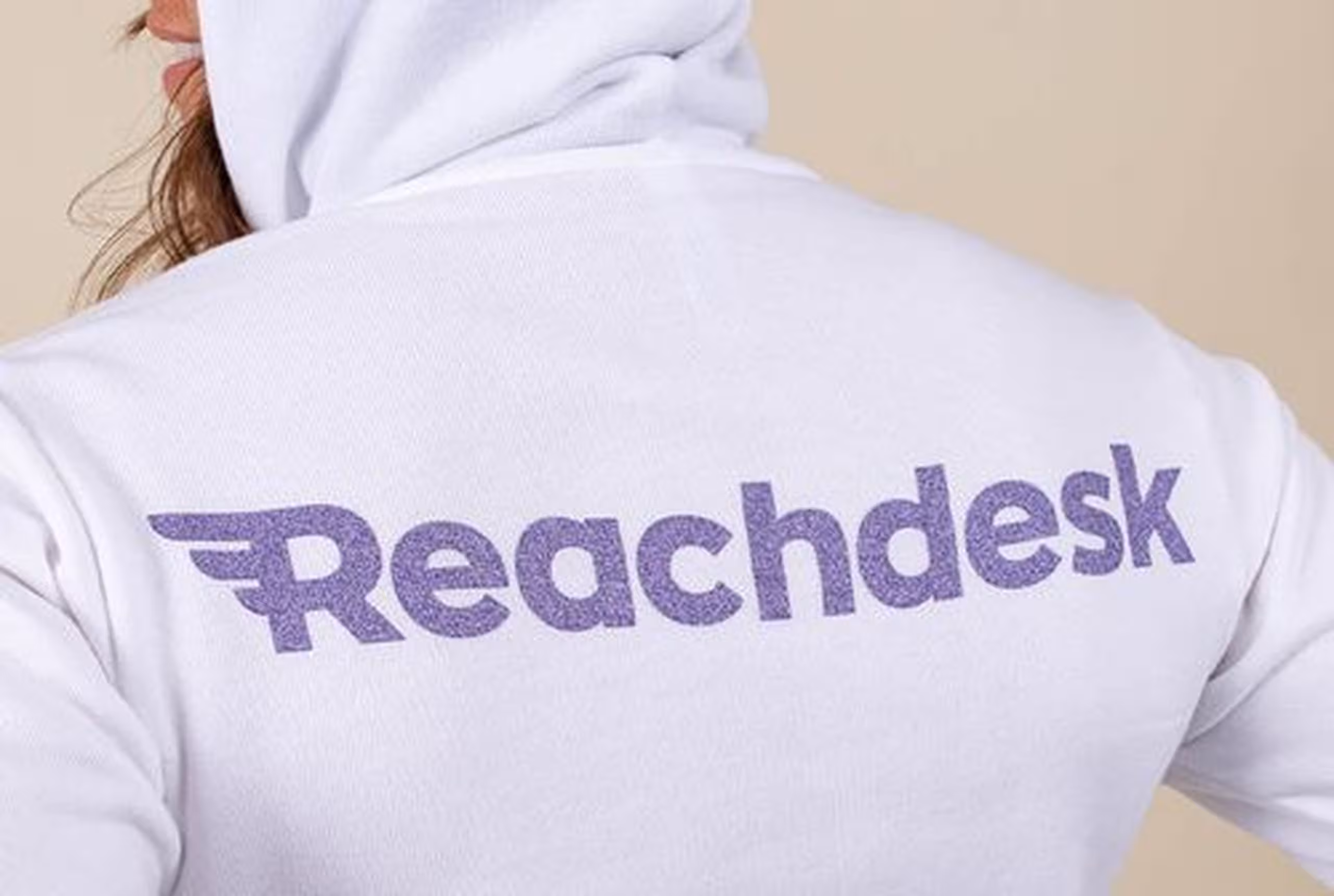 women wearing a white hoodie with metallic ink print 