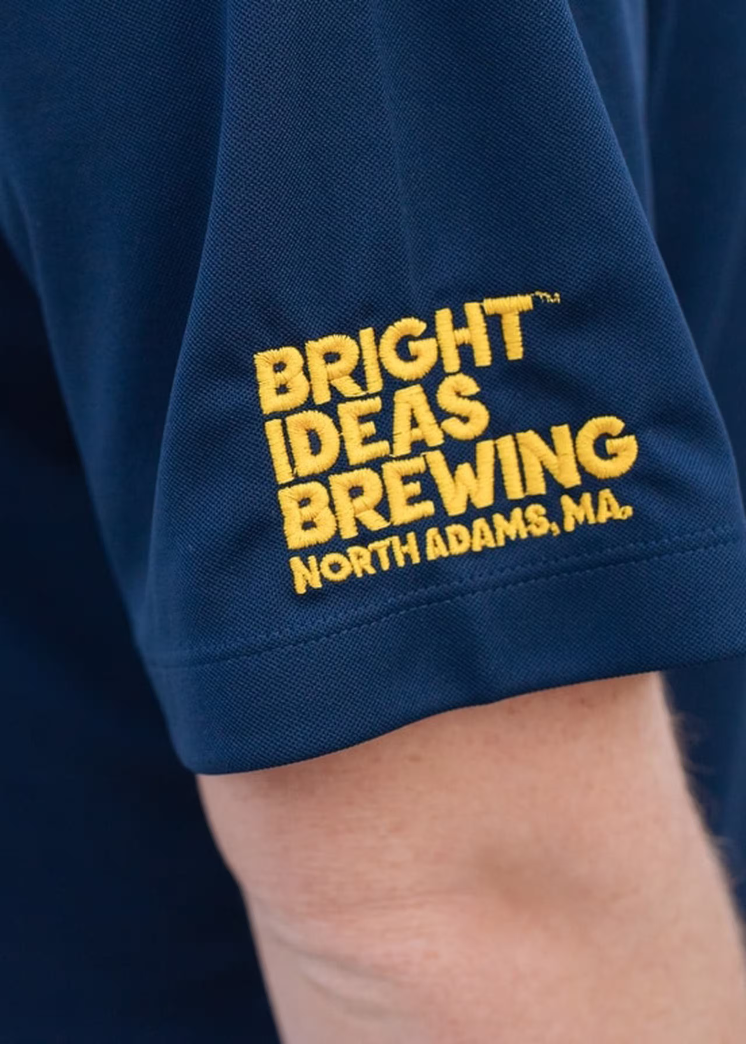 close-up of a sleeve with yellow embroidery