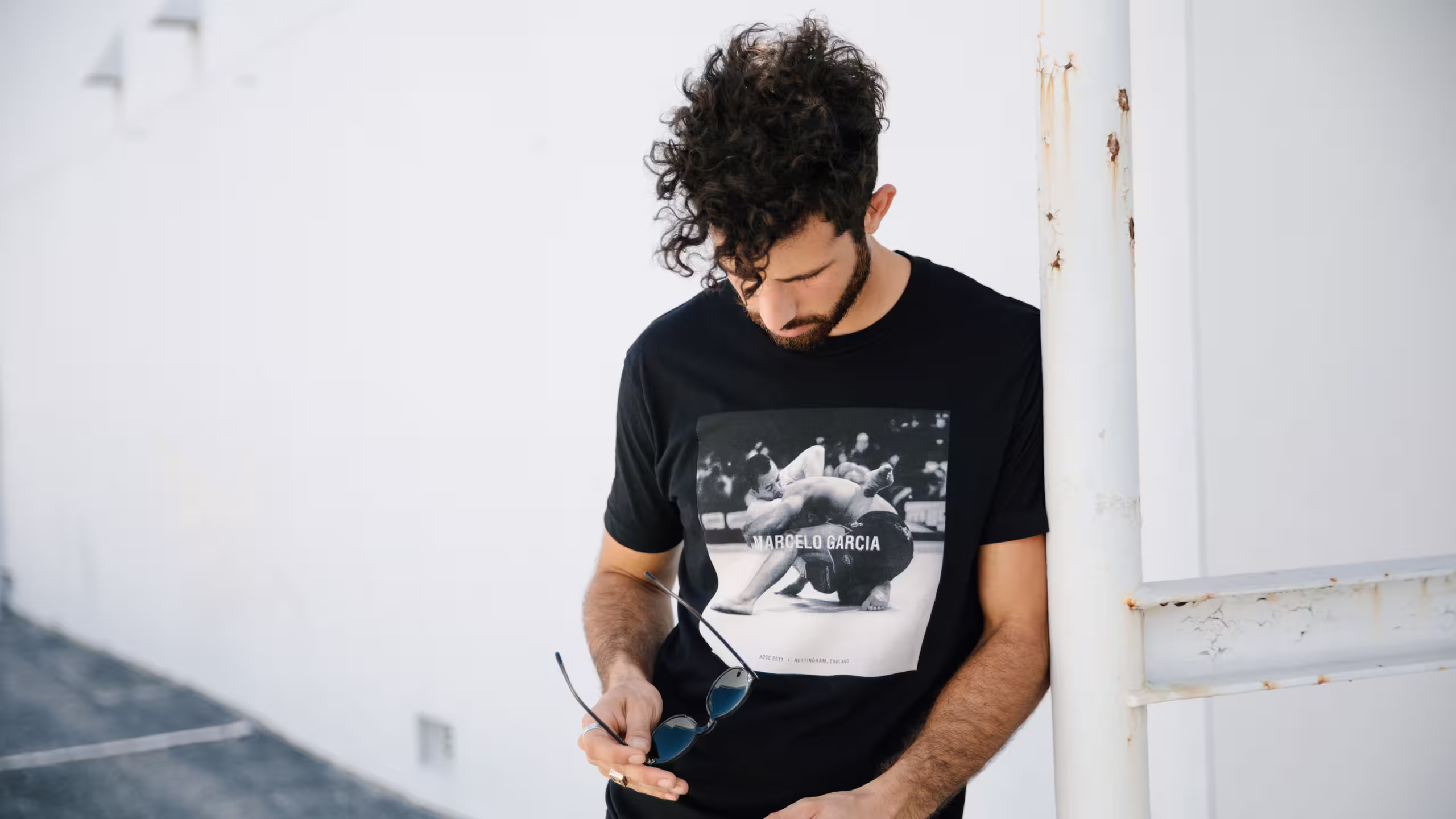man wearing a black t-shirt a black and white photorealistic print