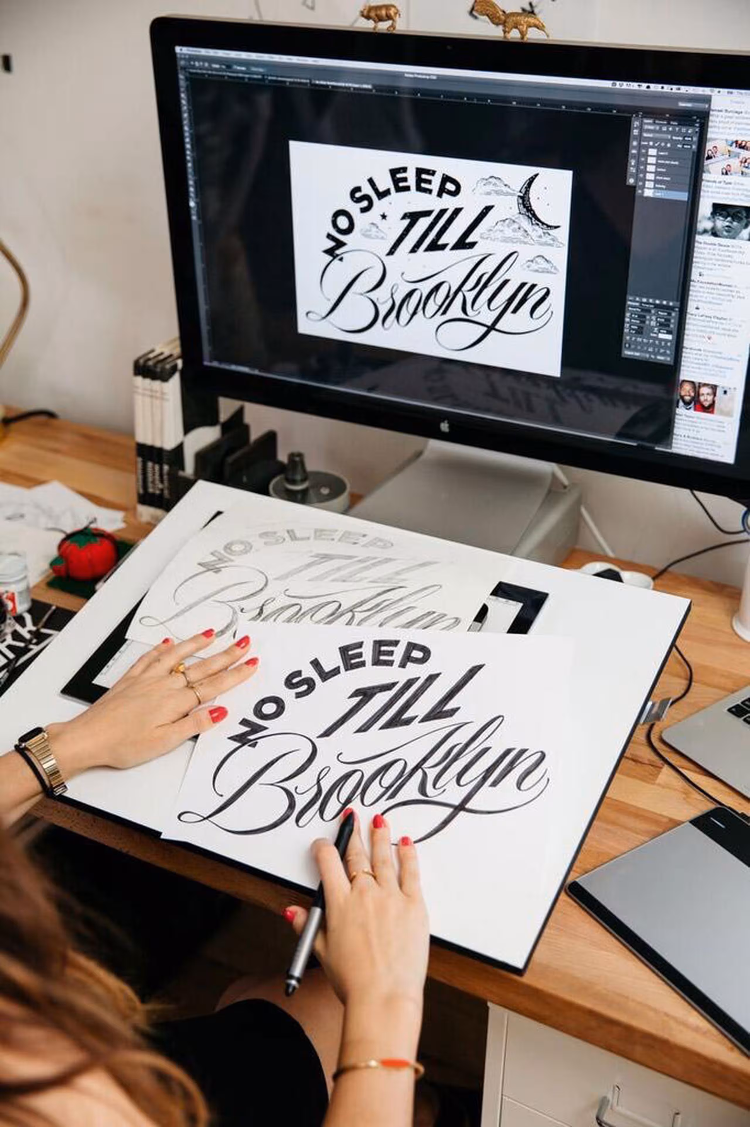 someone creating a design from sketch to computer illustration