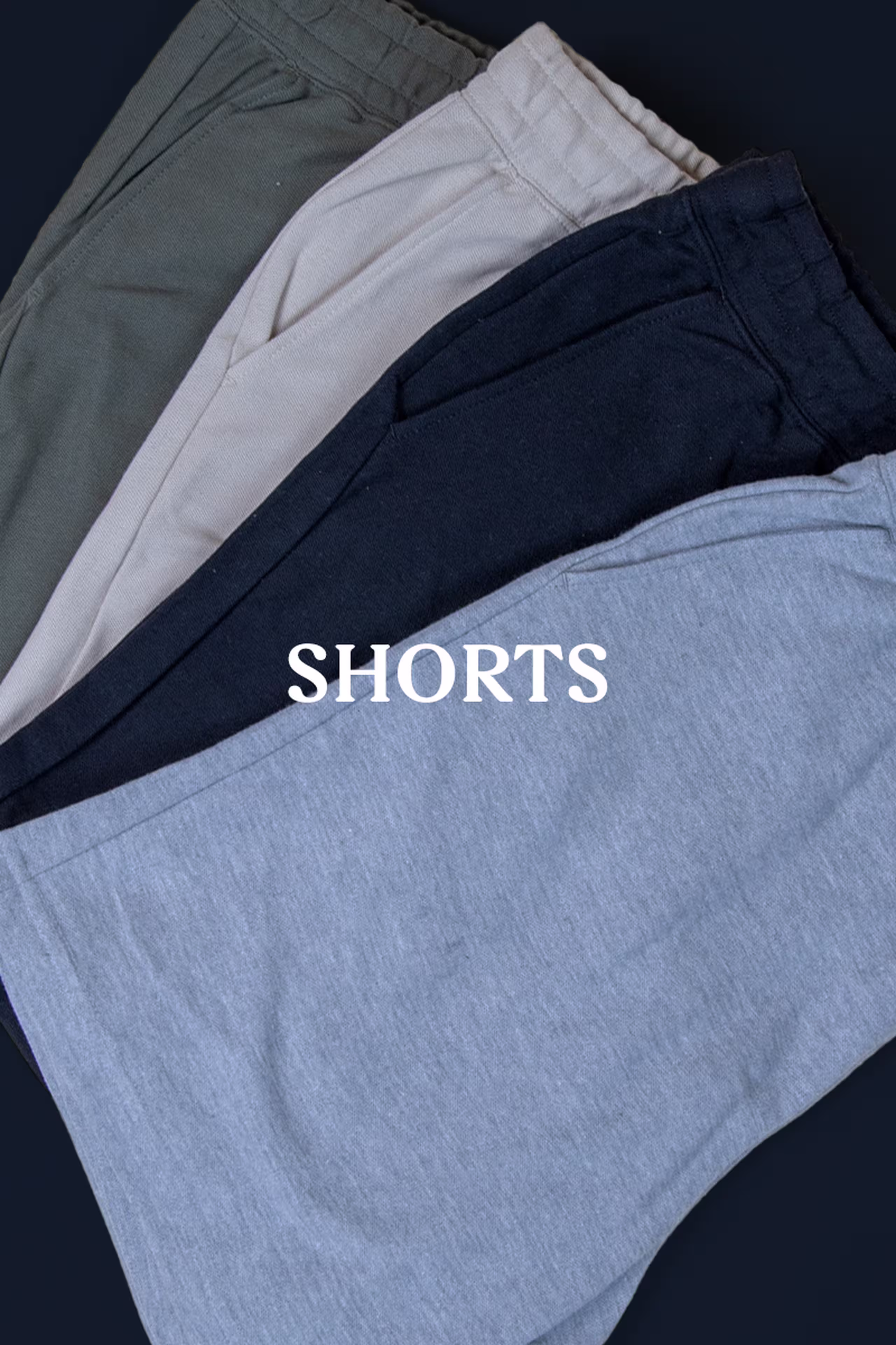 shorts - four shorts folded laying flat fanned on top of each other