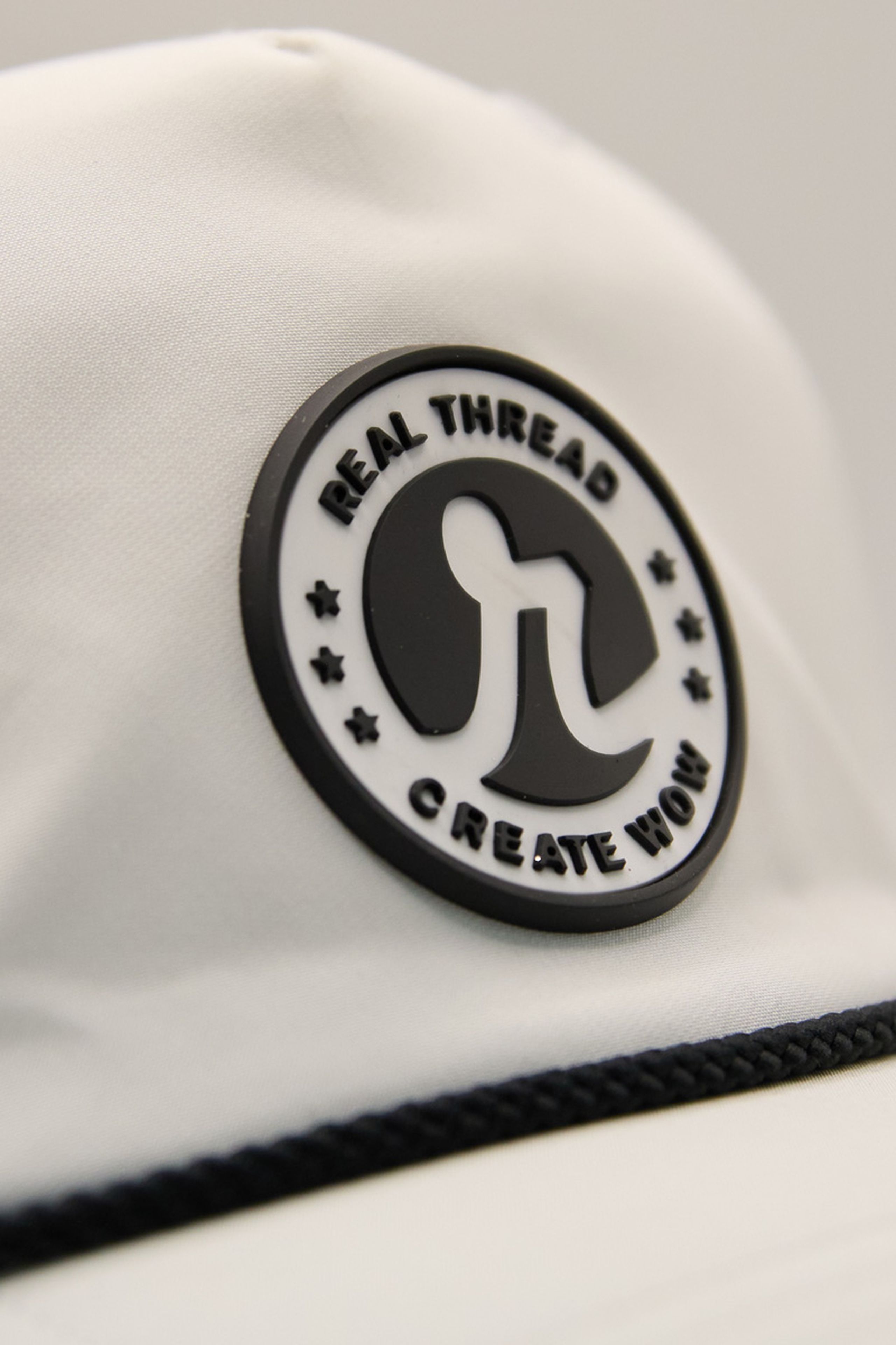 close up of the real thread molded patch on a white hat