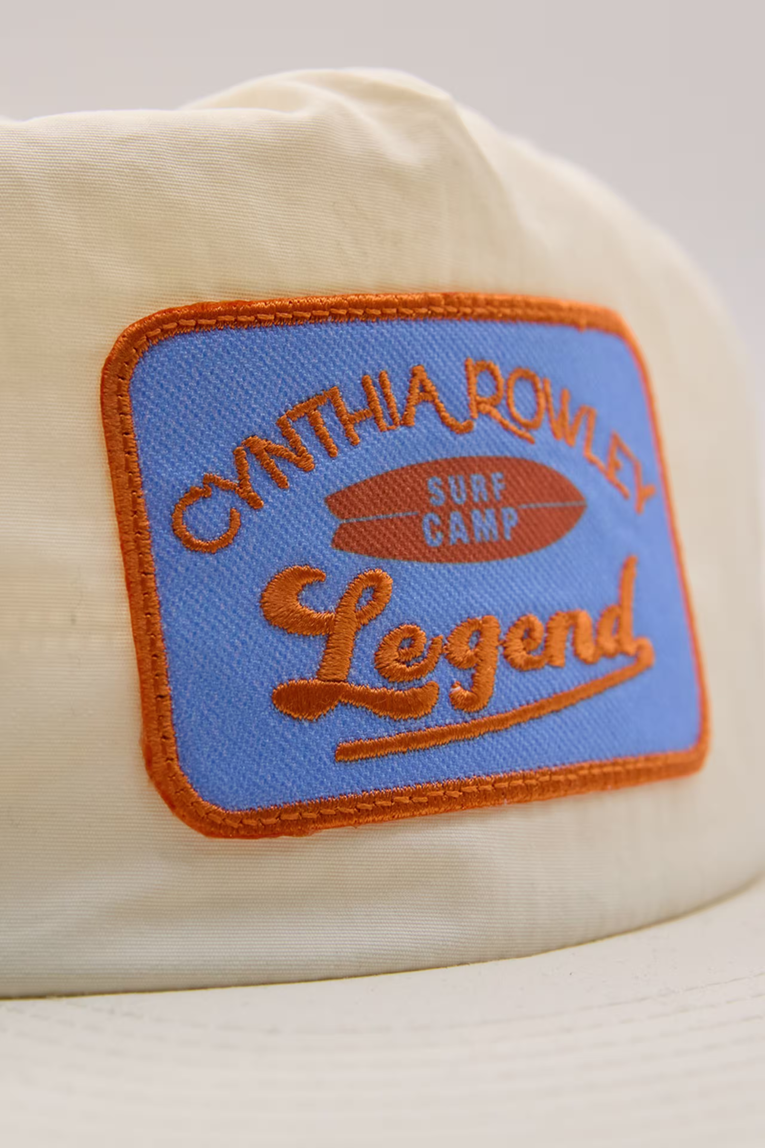 a blue and orange print stitch patch