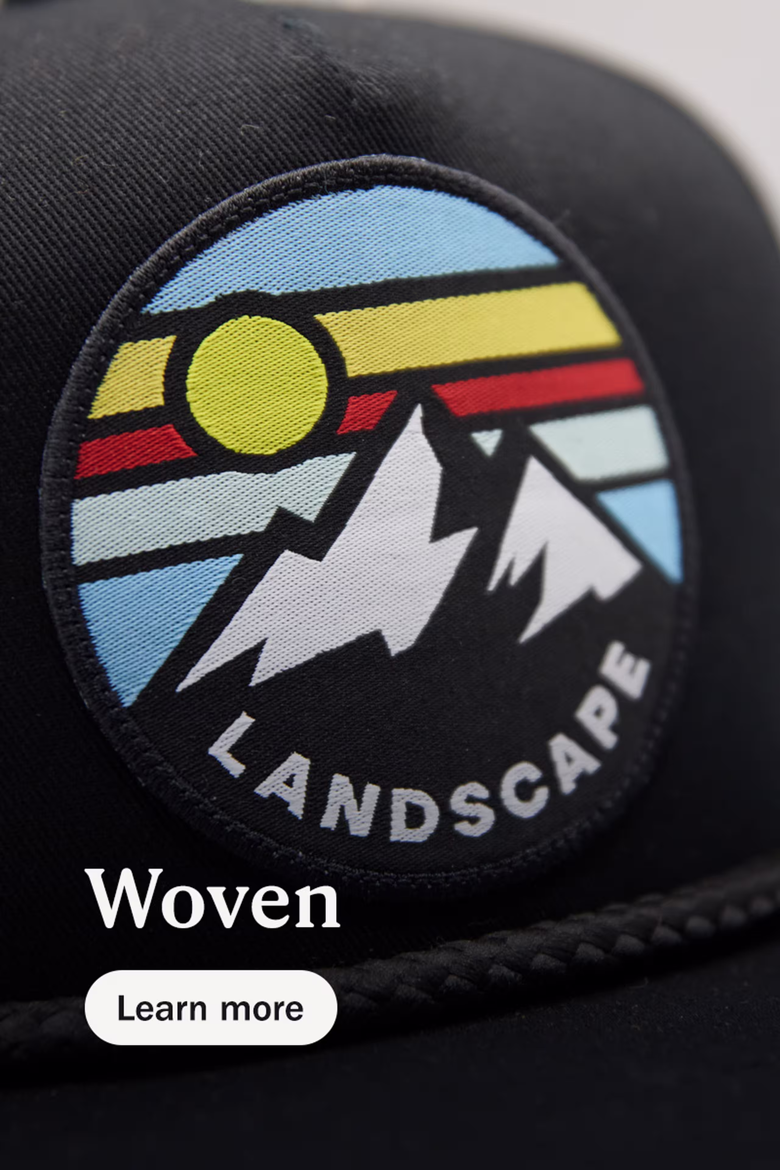 woven - learn more - circle woven patch of a mountain with the word landscape