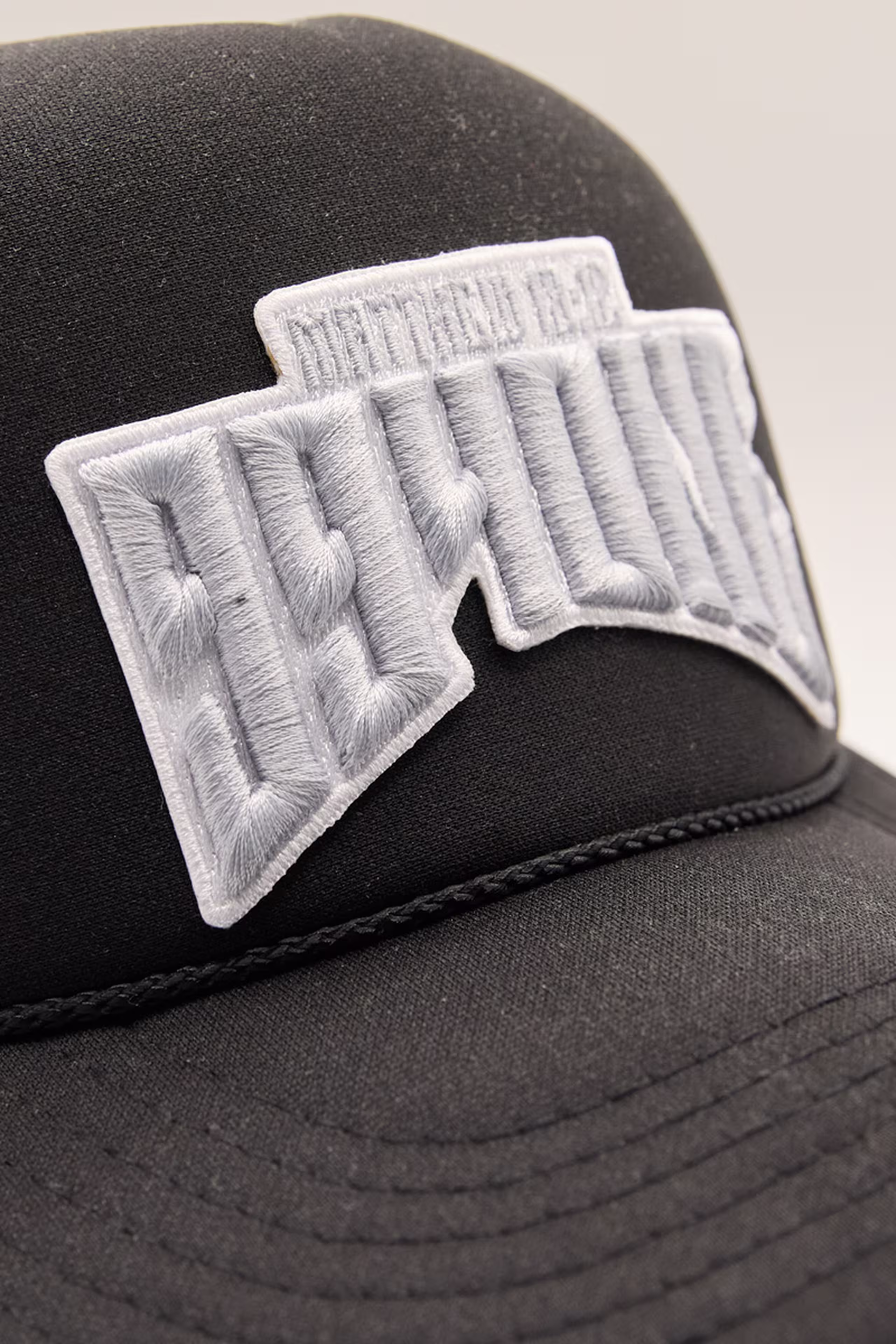 close-up of white 3d embroidery words