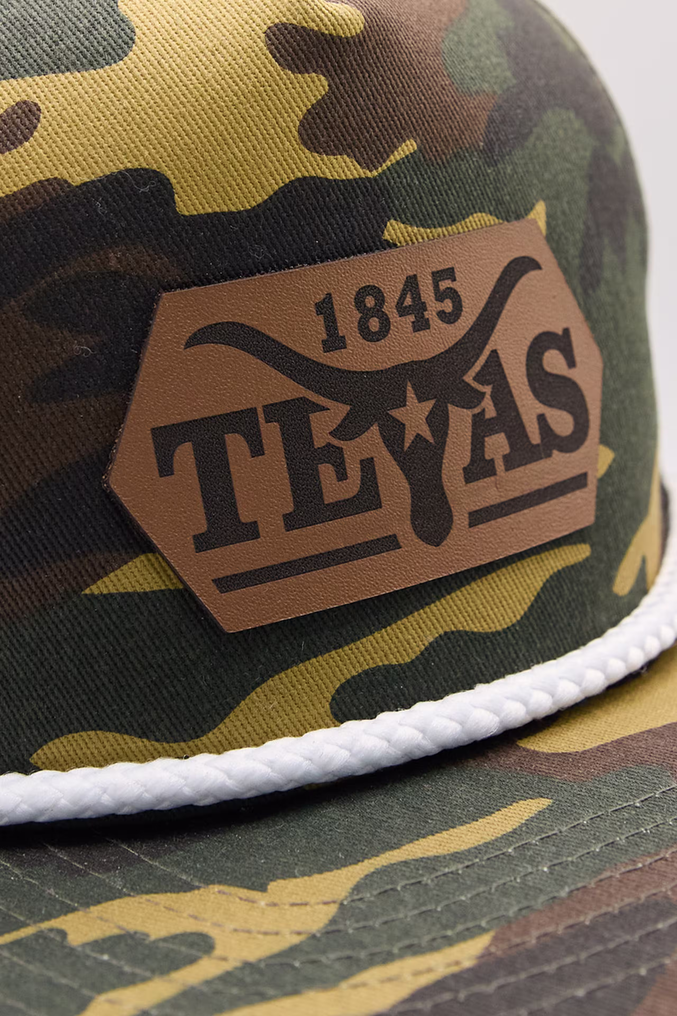 elongated polygon genuine leather patch on a camo hat