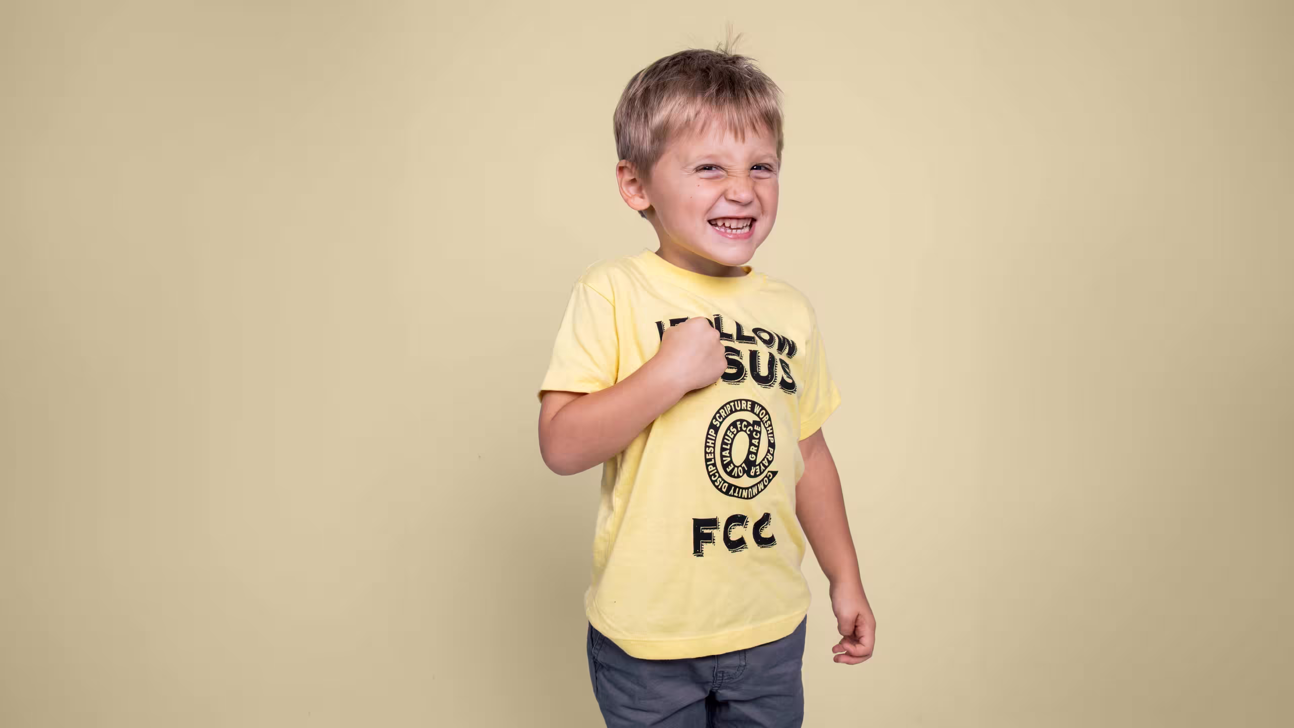 boy wearing a yellow t-shirt