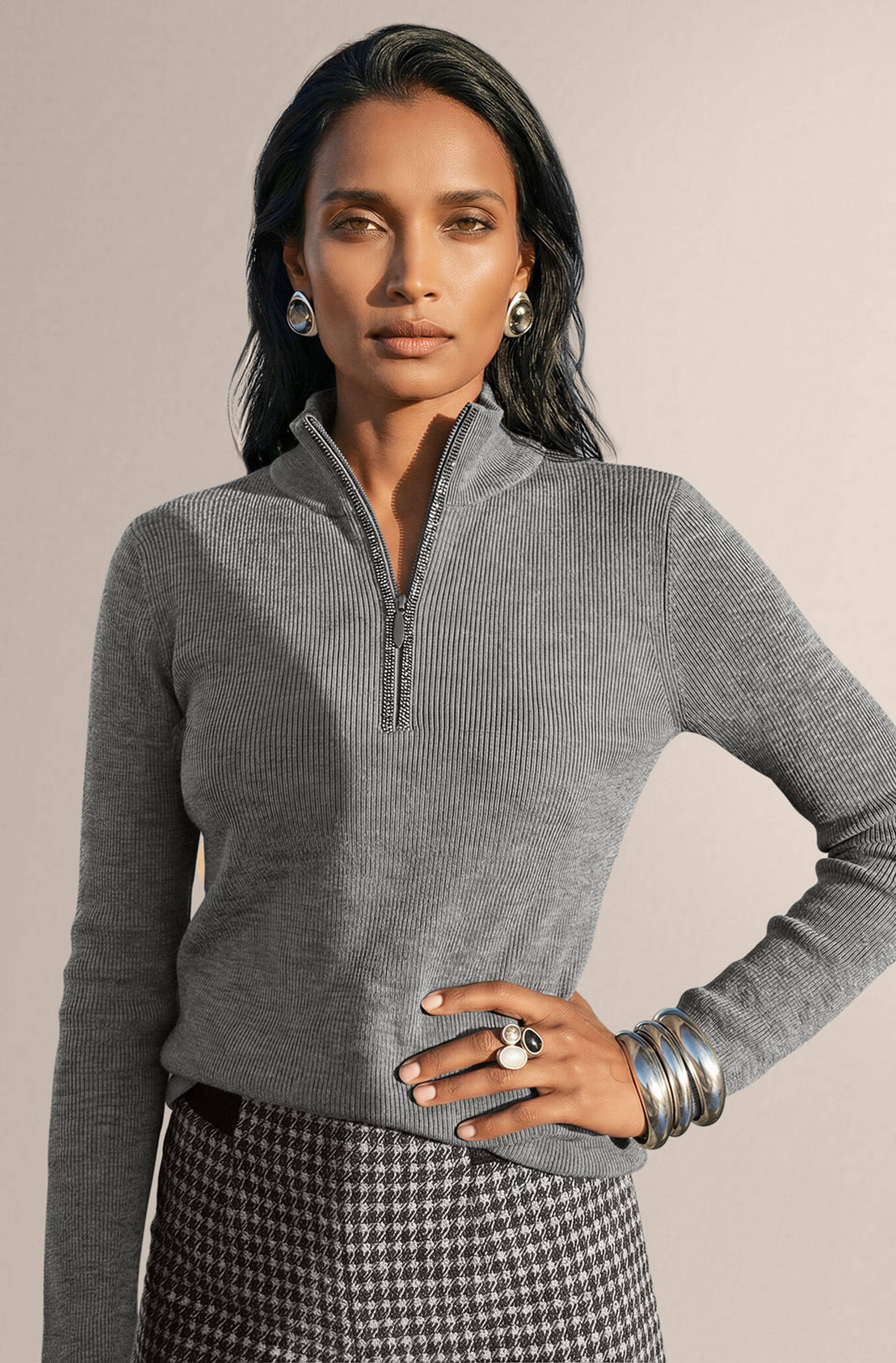 Grey virgin wool rib-knit sweater with a stand-up collar, short zipper and a slim fit.