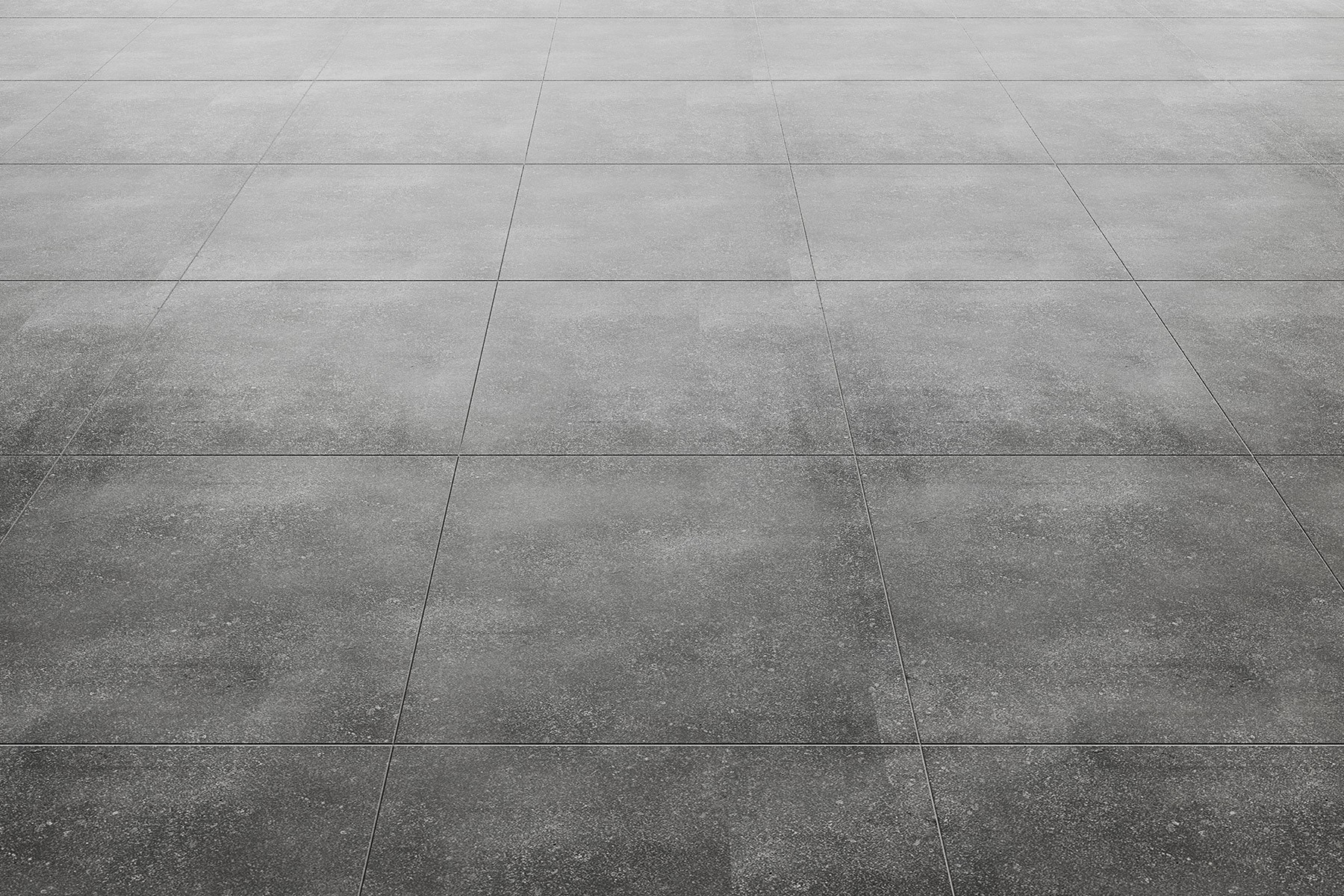 A close-up view of a gray tile floor with a smooth and polished surface, arranged in a grid pattern.
