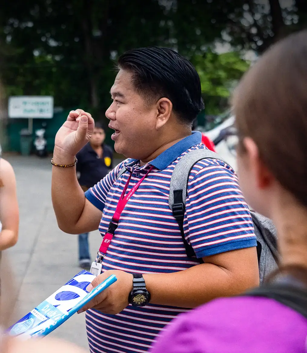 Tour Director giving instructions to students