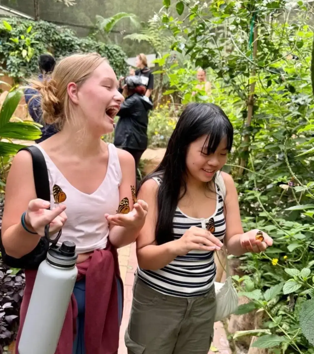 Students with butterflies in Costa Rica