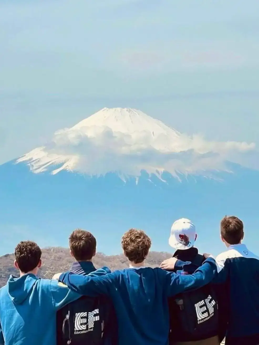 Group of travelers looking at Mount Fuji in Japan
