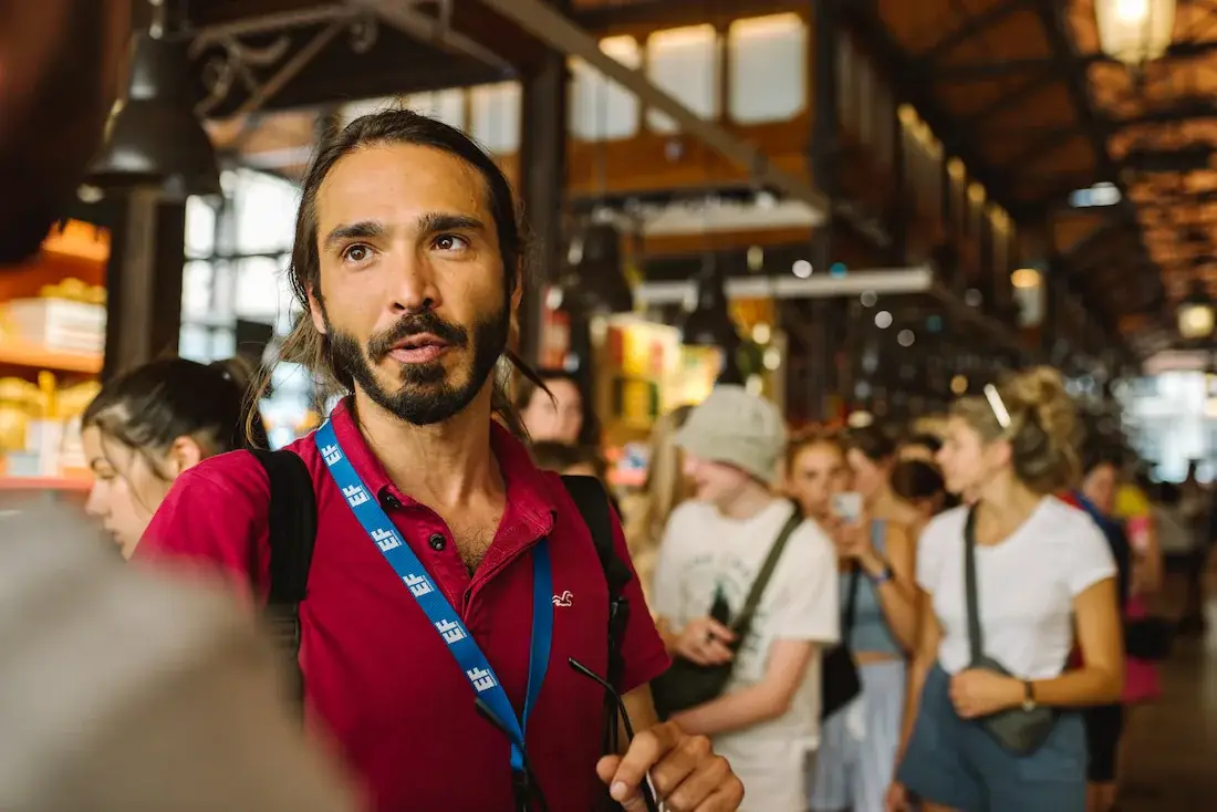 tour director with group in market
