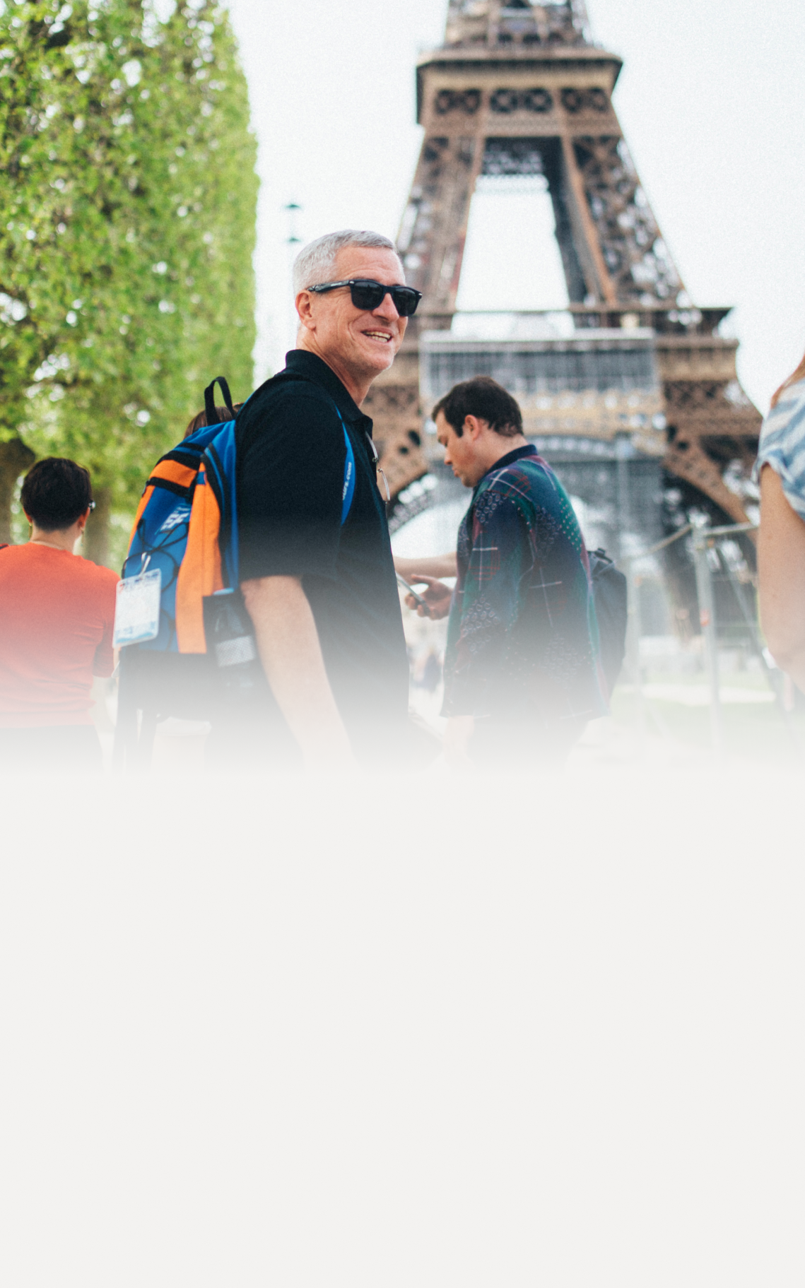 Adult traveler visiting the Eiffel Tower in Paris